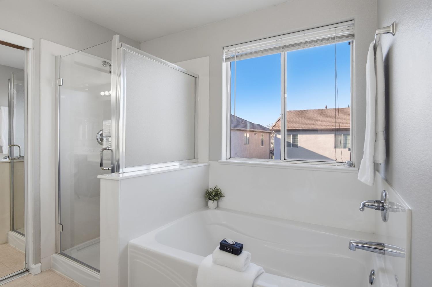 2403 Clemente Lane Tracy, CA 95377 - Photo 30 of 43 a bathroom with a bathtub and a shower