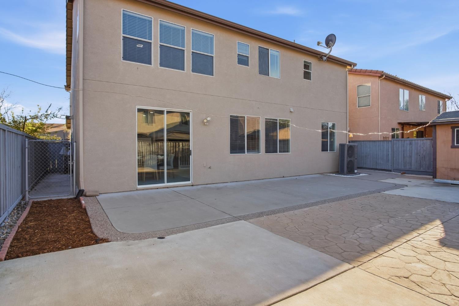 2403 Clemente Lane Tracy, CA 95377 - Photo 33 of 43 a front view of a house with a yard and garage