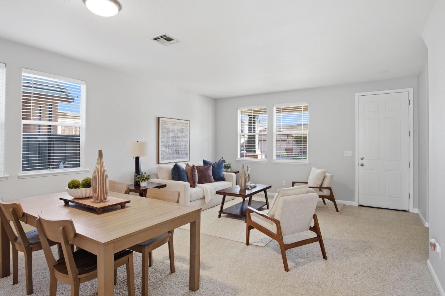 2403 Clemente Lane Tracy, CA 95377 - Photo 4 of 43 a view of a dining room with a table and chairs