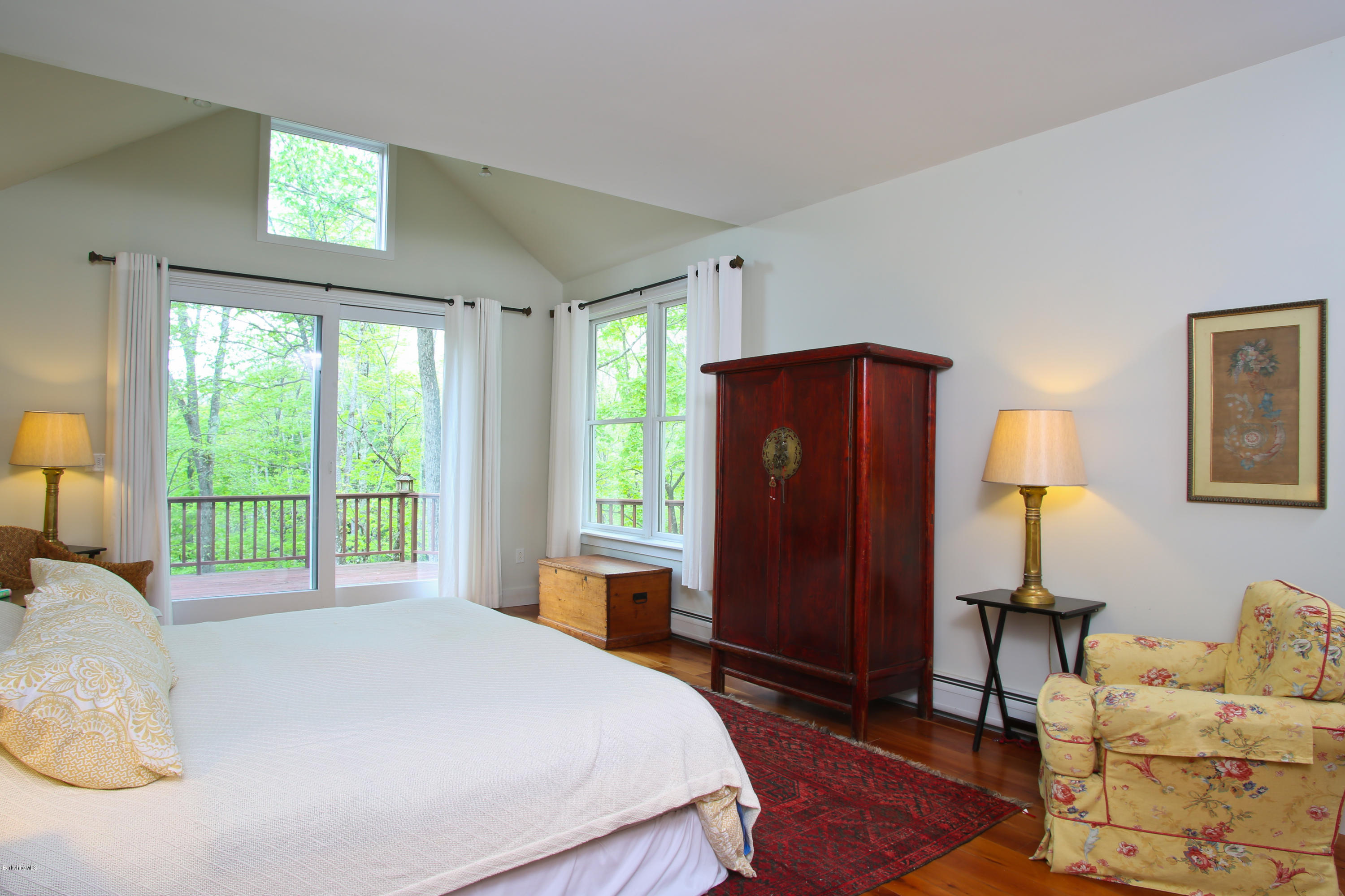 238 Rossiter Road Richmond, MA 01254 - Photo 16 of 41 a bed sitting in a spacious bedroom next to a window
