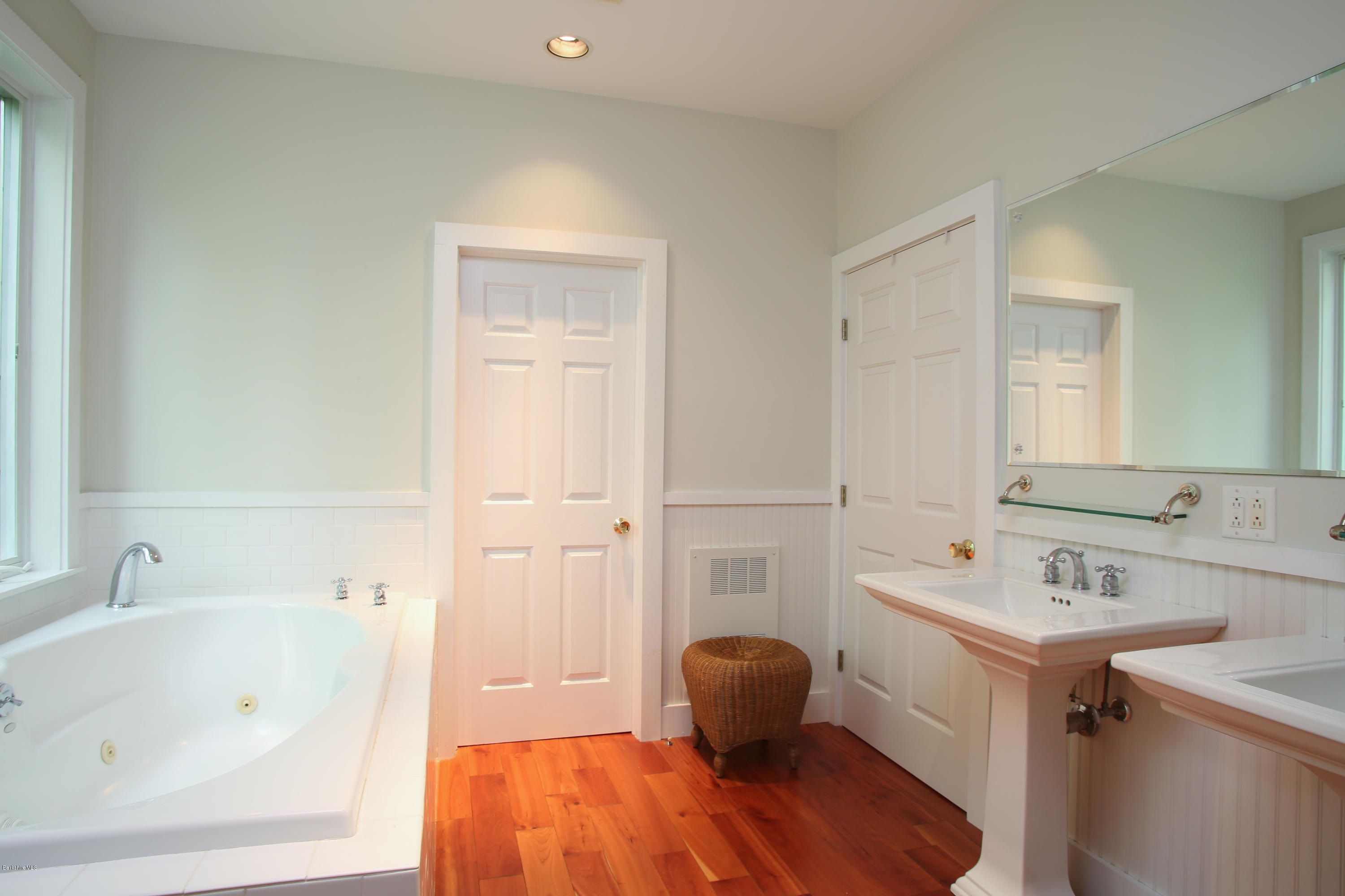 238 Rossiter Road Richmond, MA 01254 - Photo 17 of 41 a bathroom with a tub sink and mirror