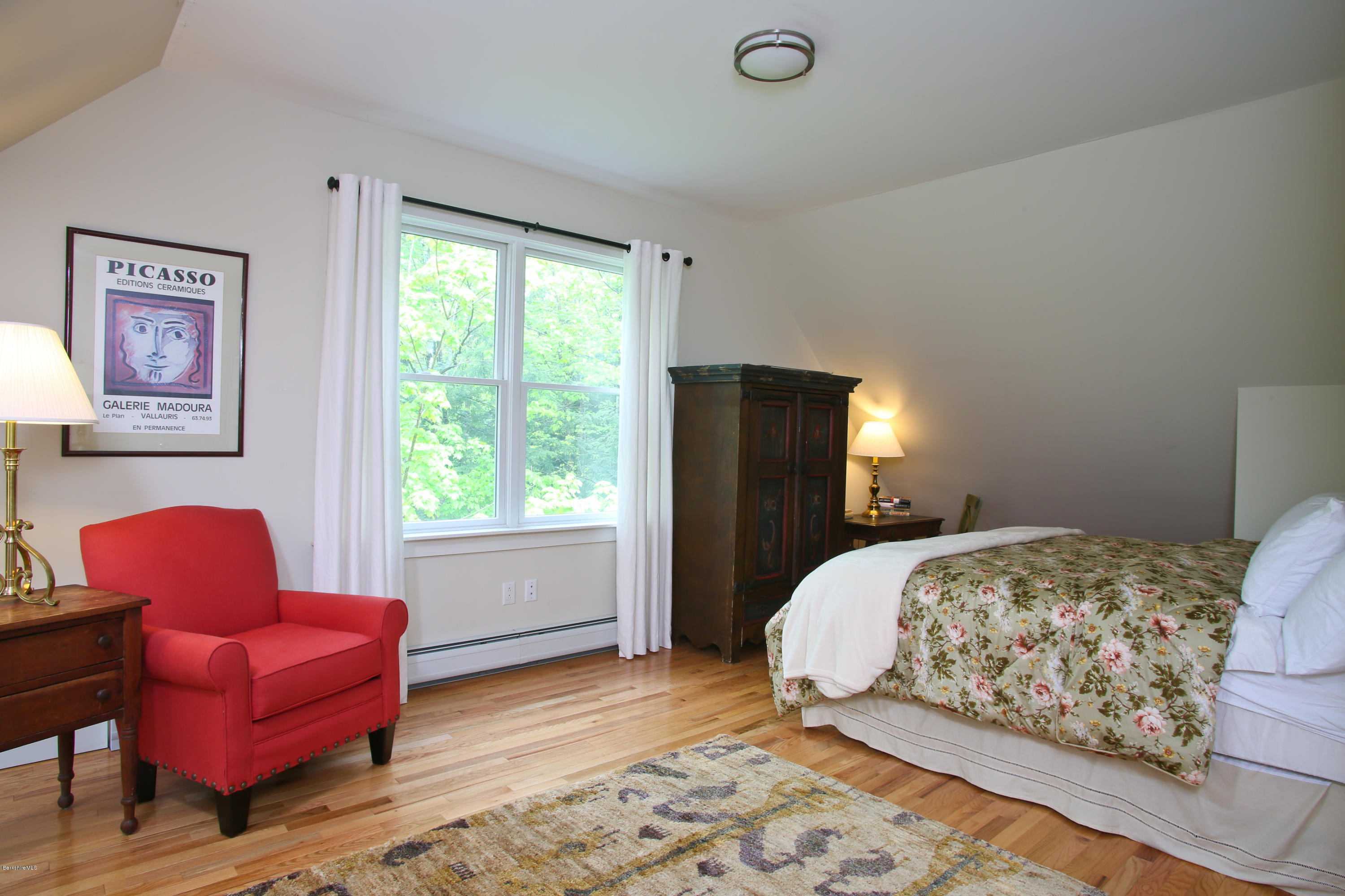 238 Rossiter Road Richmond, MA 01254 - Photo 18 of 41 a bedroom with a bed and wooden floor
