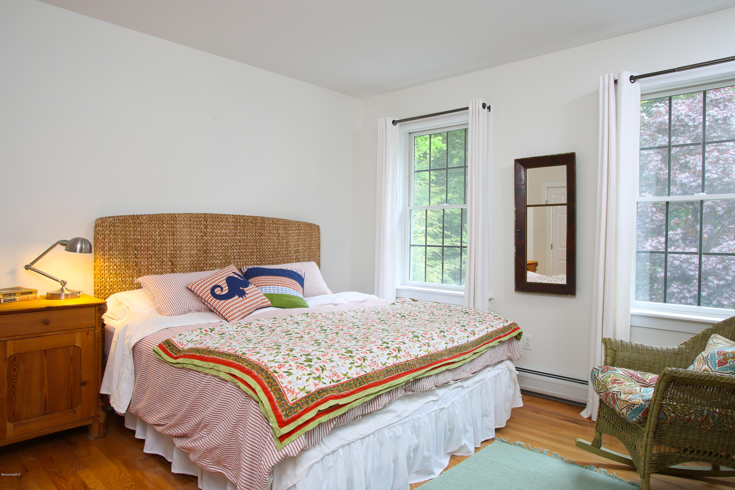 238 Rossiter Road Richmond, MA 01254 - Photo 19 of 41 a bedroom with a bed and wooden floor