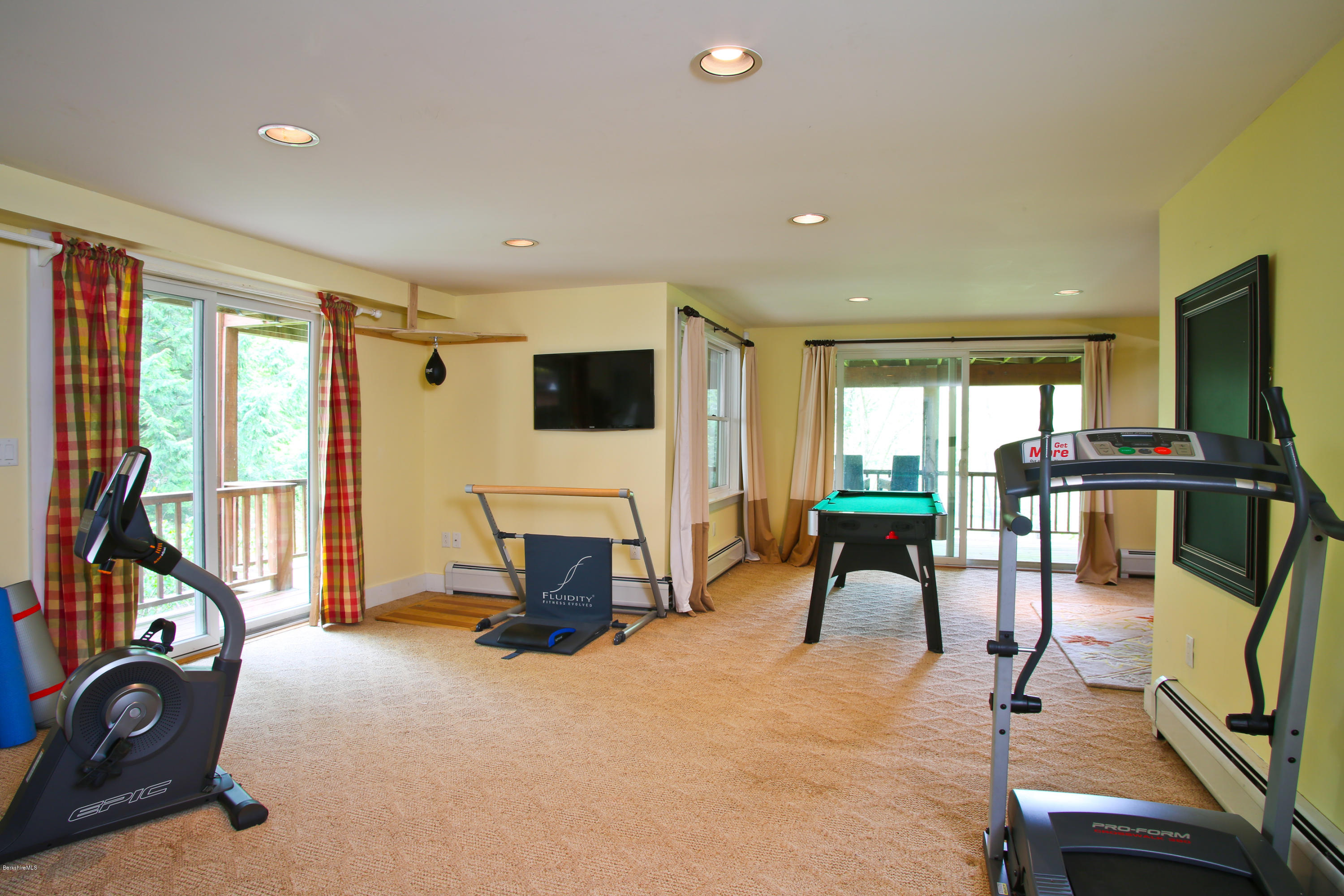 238 Rossiter Road Richmond, MA 01254 - Photo 24 of 41 a view of a livingroom with furniture and a flat screen tv