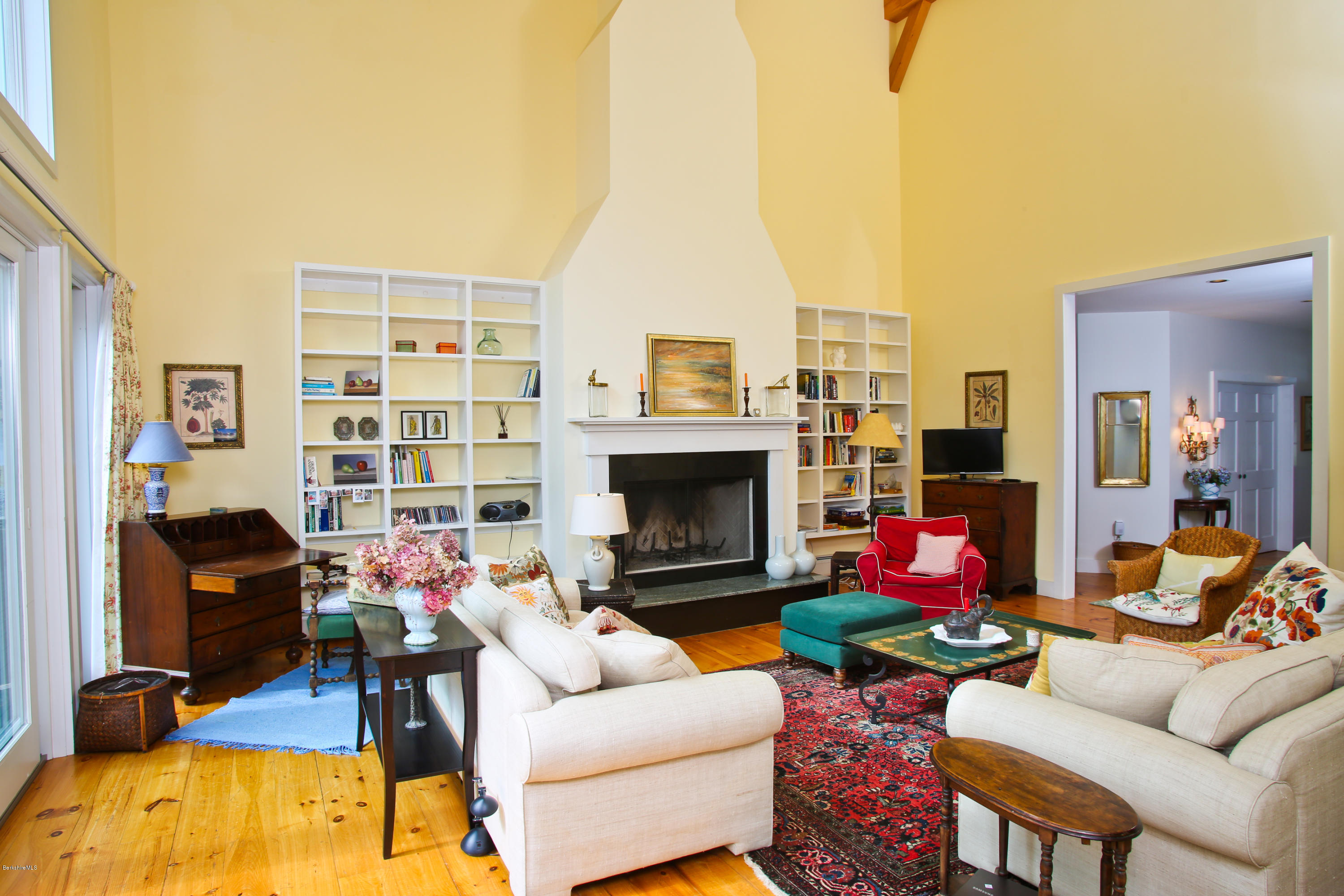 238 Rossiter Road Richmond, MA 01254 - Photo 10 of 41 a living room with furniture a fireplace and a flat screen tv