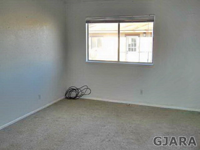 1301 20 Road Fruita, CO 81521 - Photo 4 of 15 an empty room with a window