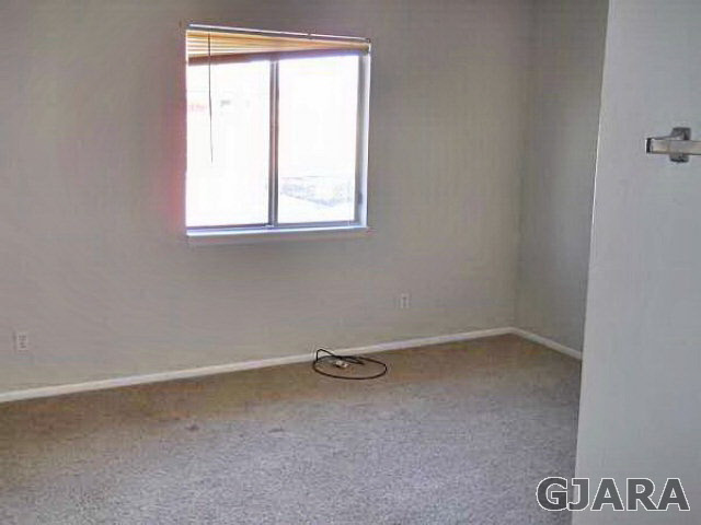 1301 20 Road Fruita, CO 81521 - Photo 5 of 15 an empty room with a window