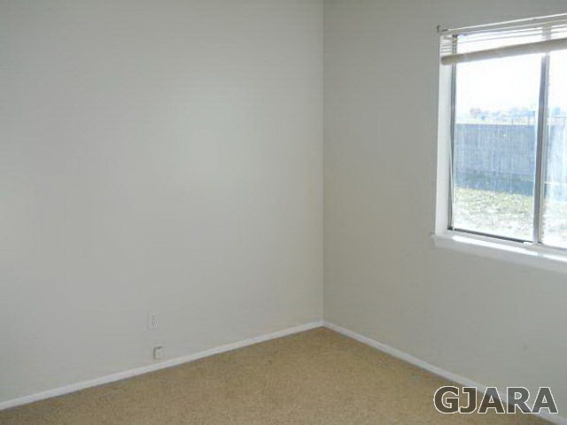 1301 20 Road Fruita, CO 81521 - Photo 8 of 15 an empty room with a window