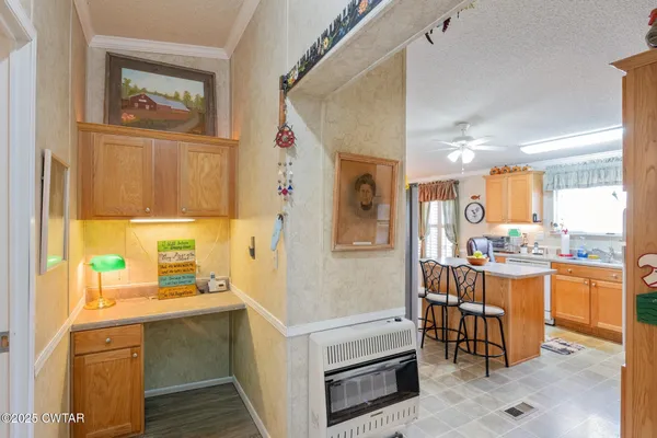 a kitchen with a refrigerator and a sink