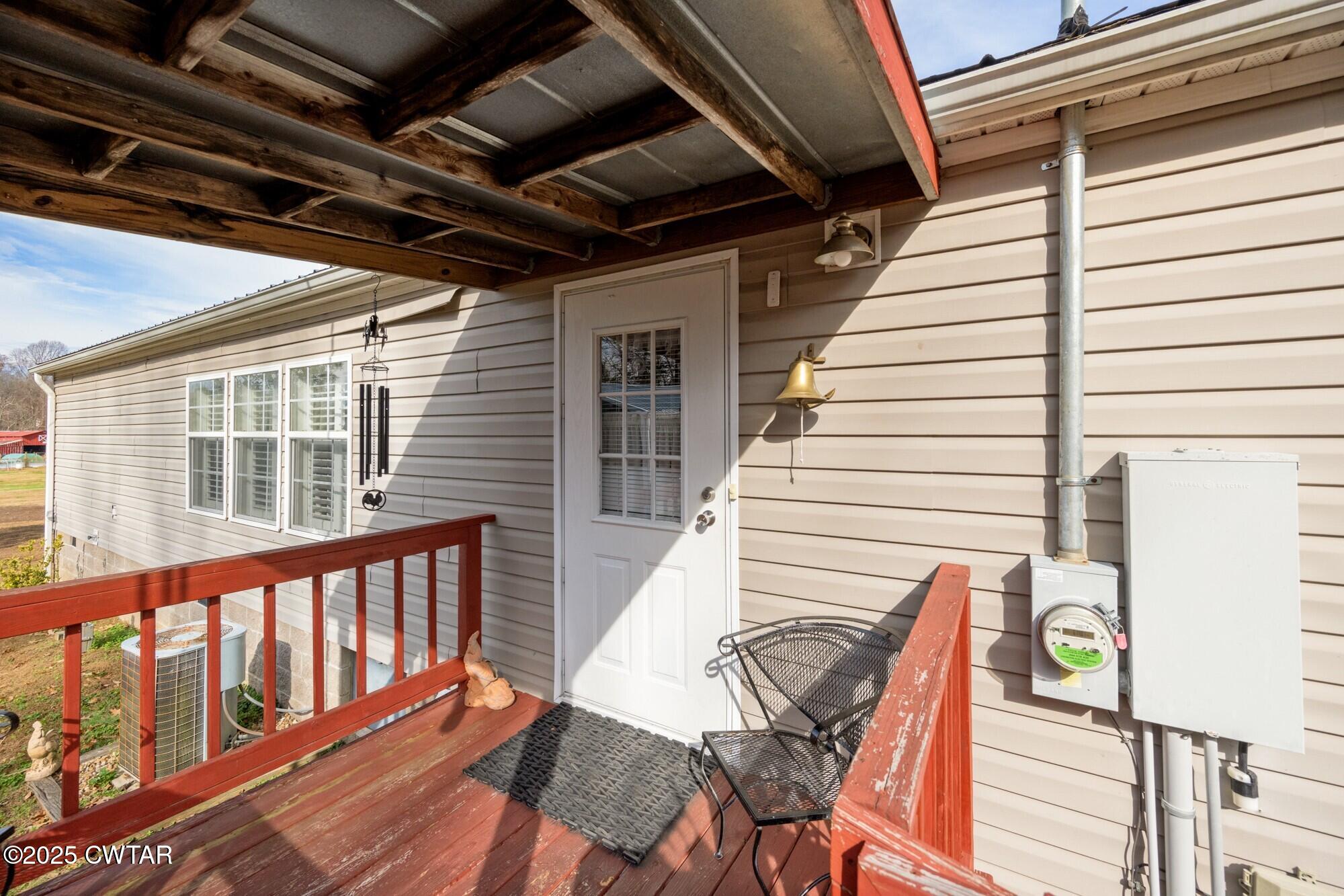 416 Haney School Road Decaturville, TN 38329 - Photo 20 of 35 a view of a patio with wooden floor