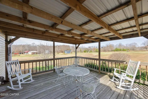 a view of a chair and table on the wooden floor