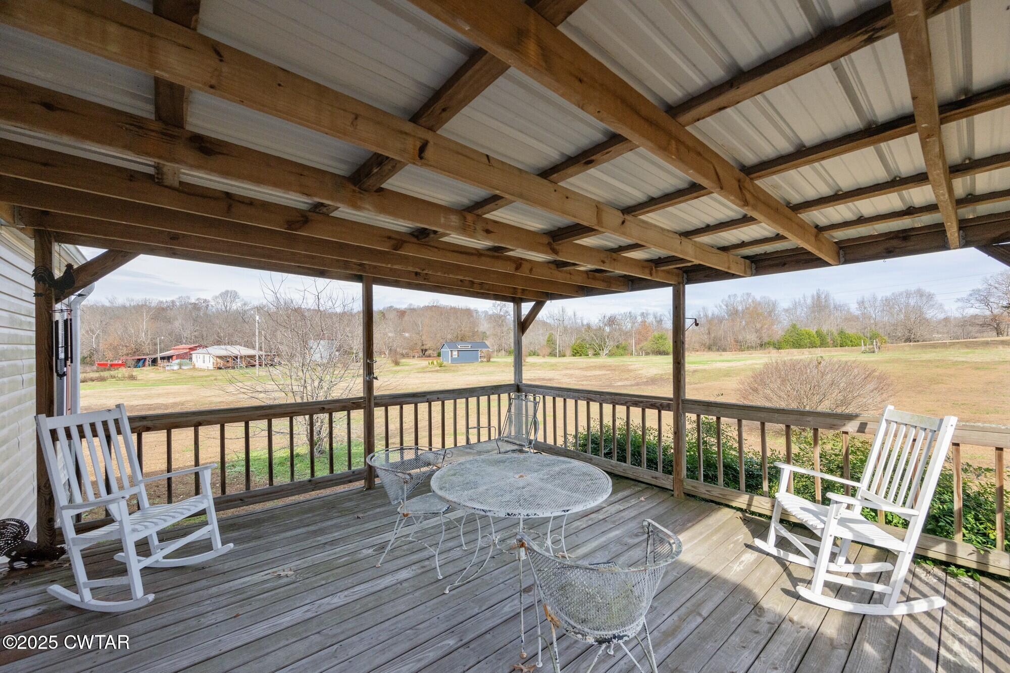 416 Haney School Road Decaturville, TN 38329 - Photo 21 of 35 a view of a chair and table on the wooden floor