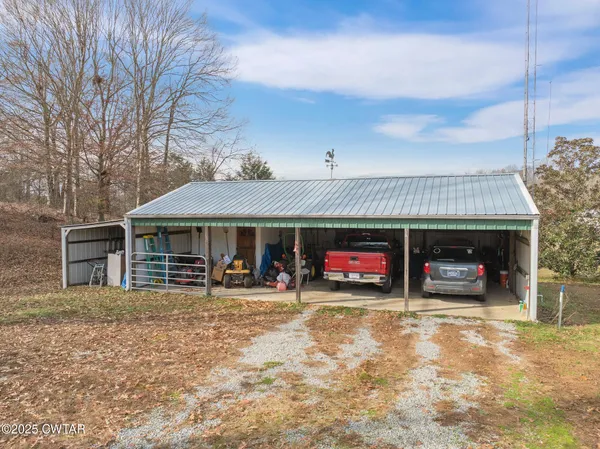 a view of a car park in front of house
