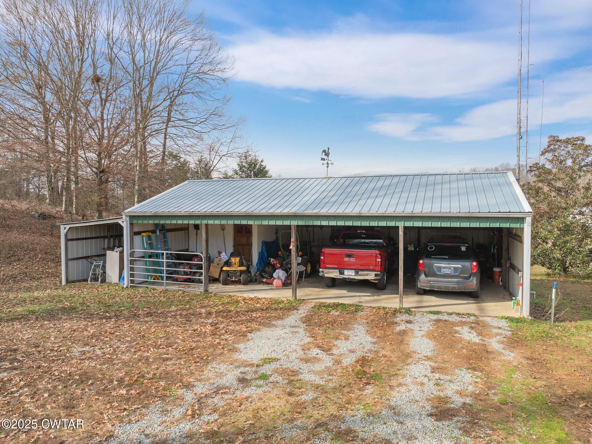 416 Haney School Road Decaturville, TN 38329 - Photo 24 of 35 a view of a car park in front of house