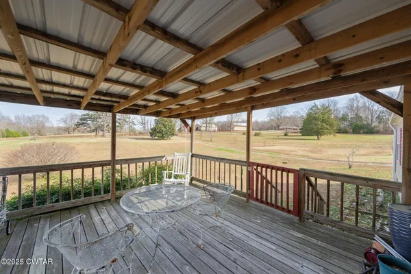 a view of a balcony with wooden floor