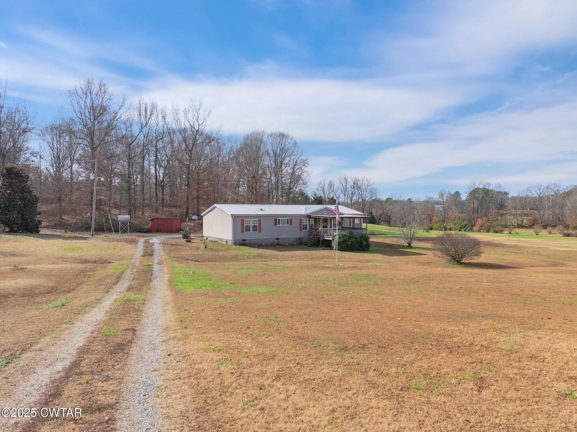 416 Haney School Road Decaturville, TN 38329 - Photo 31 of 35 a view of a lake with houses