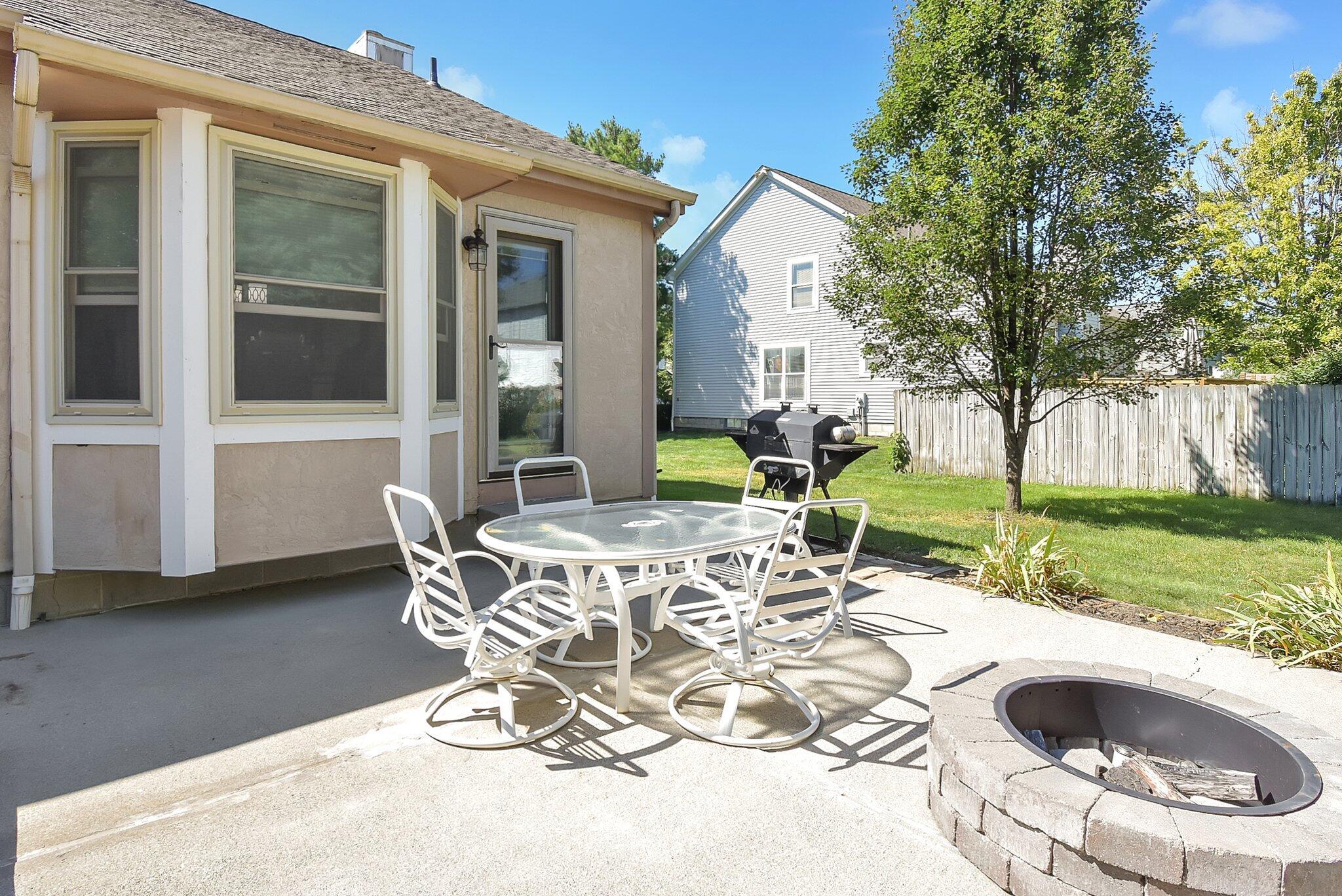 1112 Rousseau Lane Galloway, OH 43119 - Photo 32 of 43 Patio with Fire Pit and Natural Gas Grill