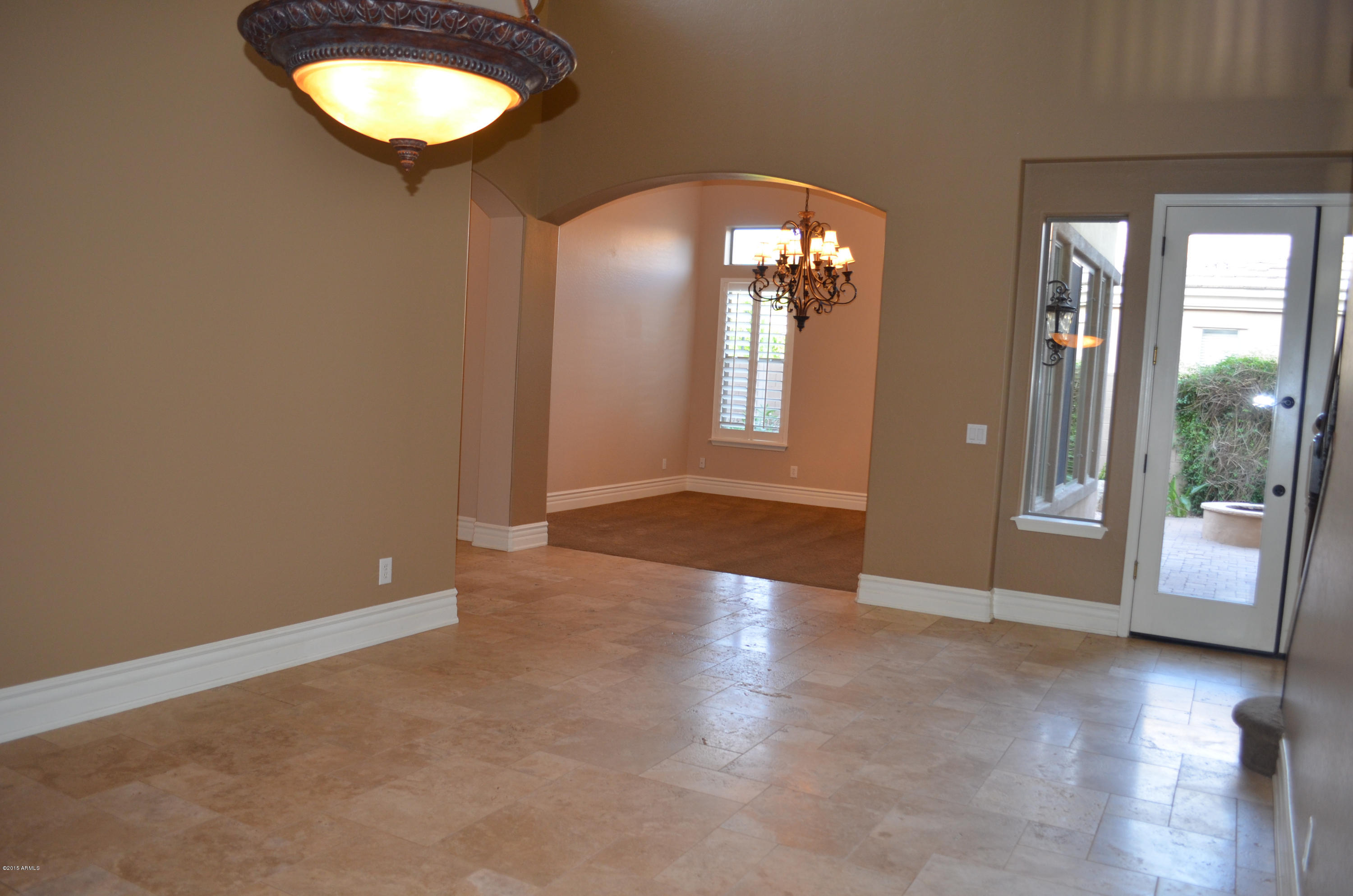 2941 Washington Avenue Gilbert, AZ 85234 - Photo 12 of 57 an empty room with wooden floor and windows
