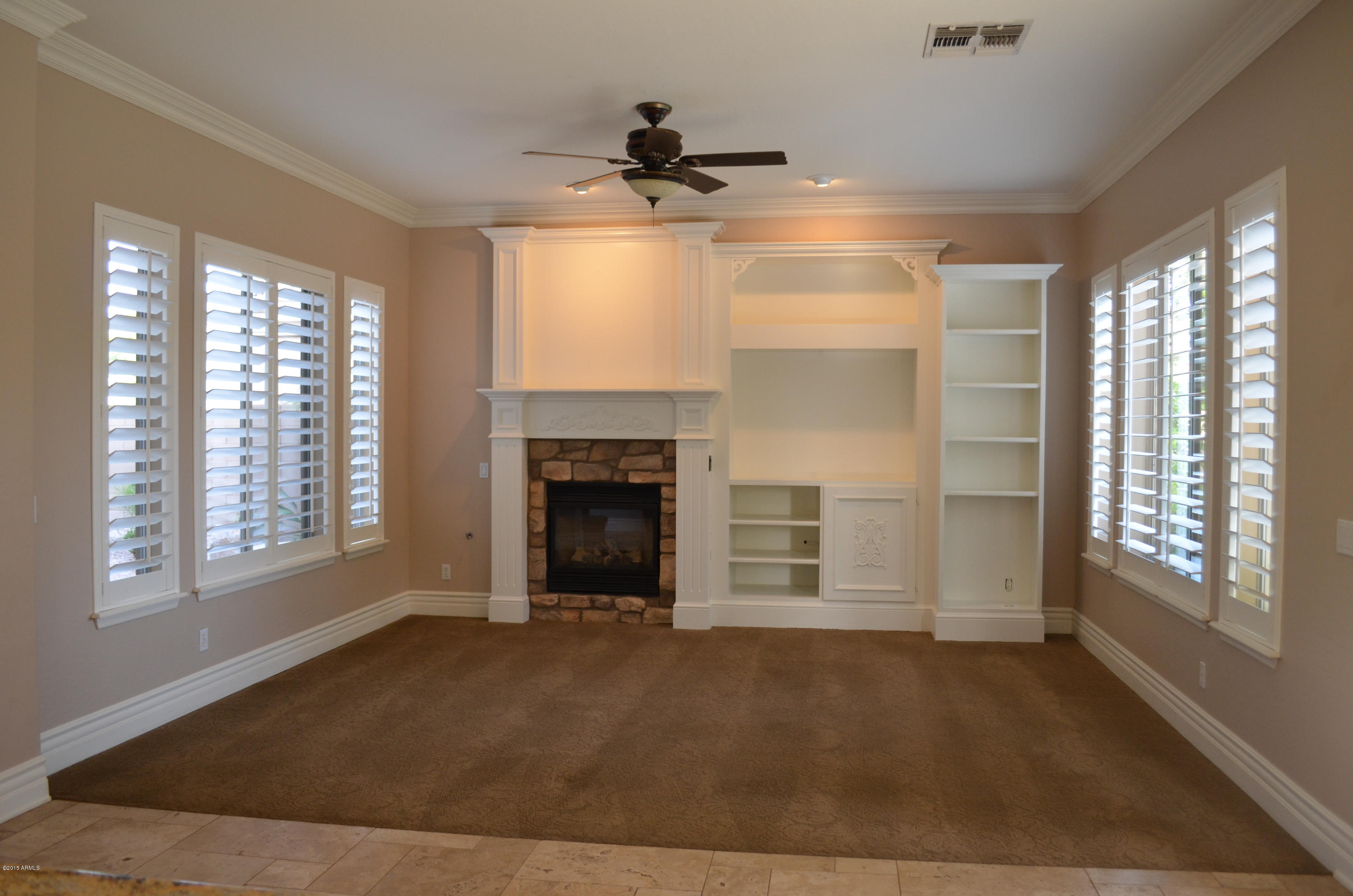 2941 Washington Avenue Gilbert, AZ 85234 - Photo 14 of 57 a view of an empty room with a fireplace and a window