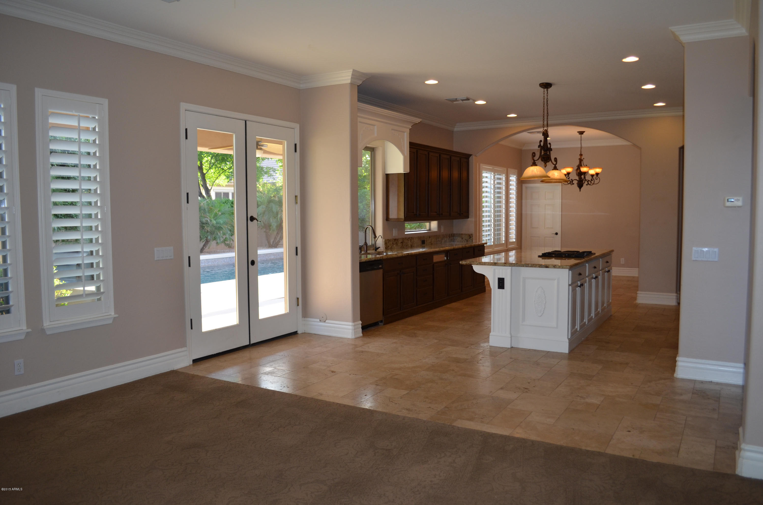2941 Washington Avenue Gilbert, AZ 85234 - Photo 16 of 57 a view of a kitchen with kitchen island wooden floor and stainless steel appliances