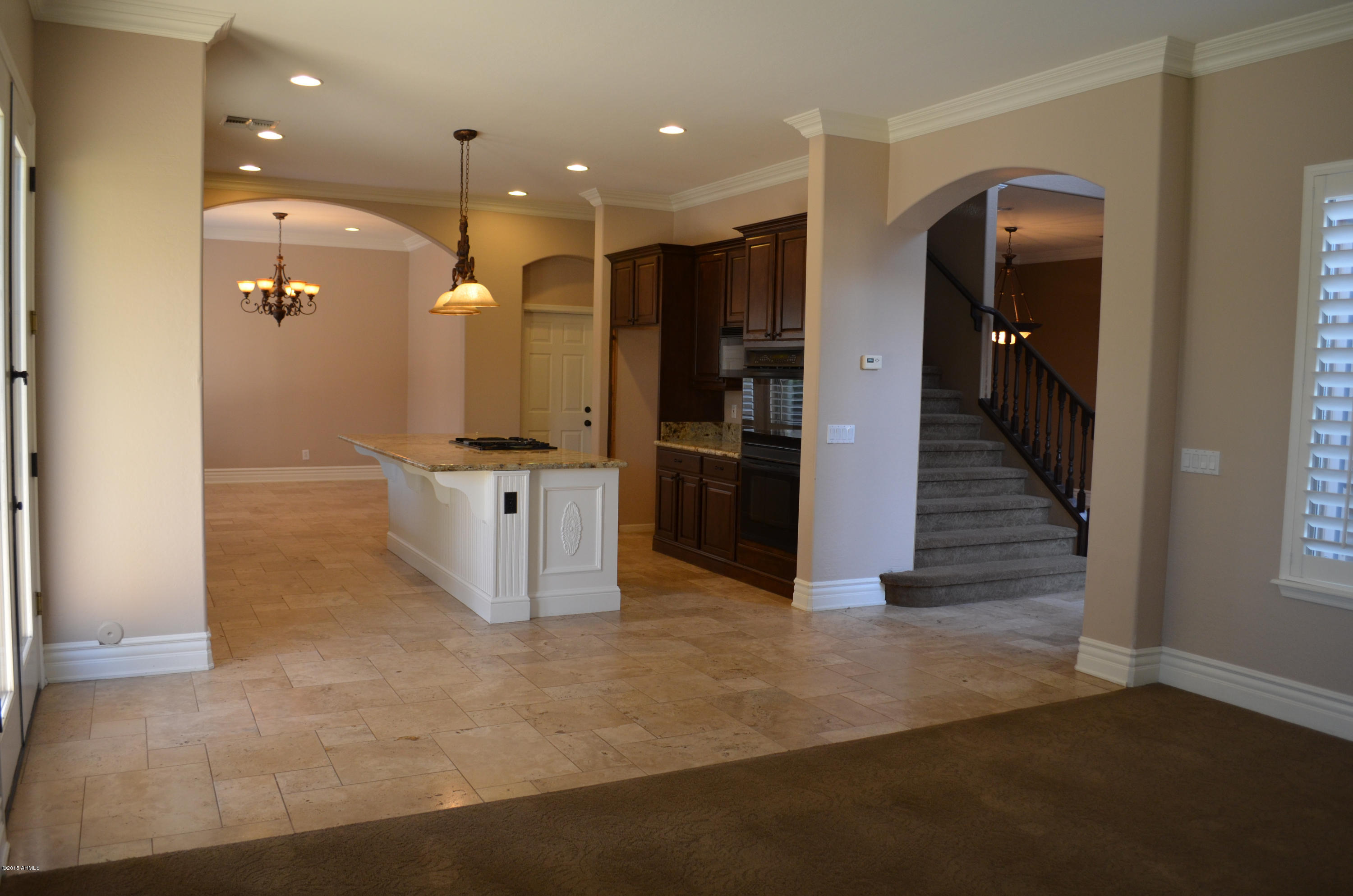 2941 Washington Avenue Gilbert, AZ 85234 - Photo 17 of 57 an open kitchen with a refrigerator and a sink