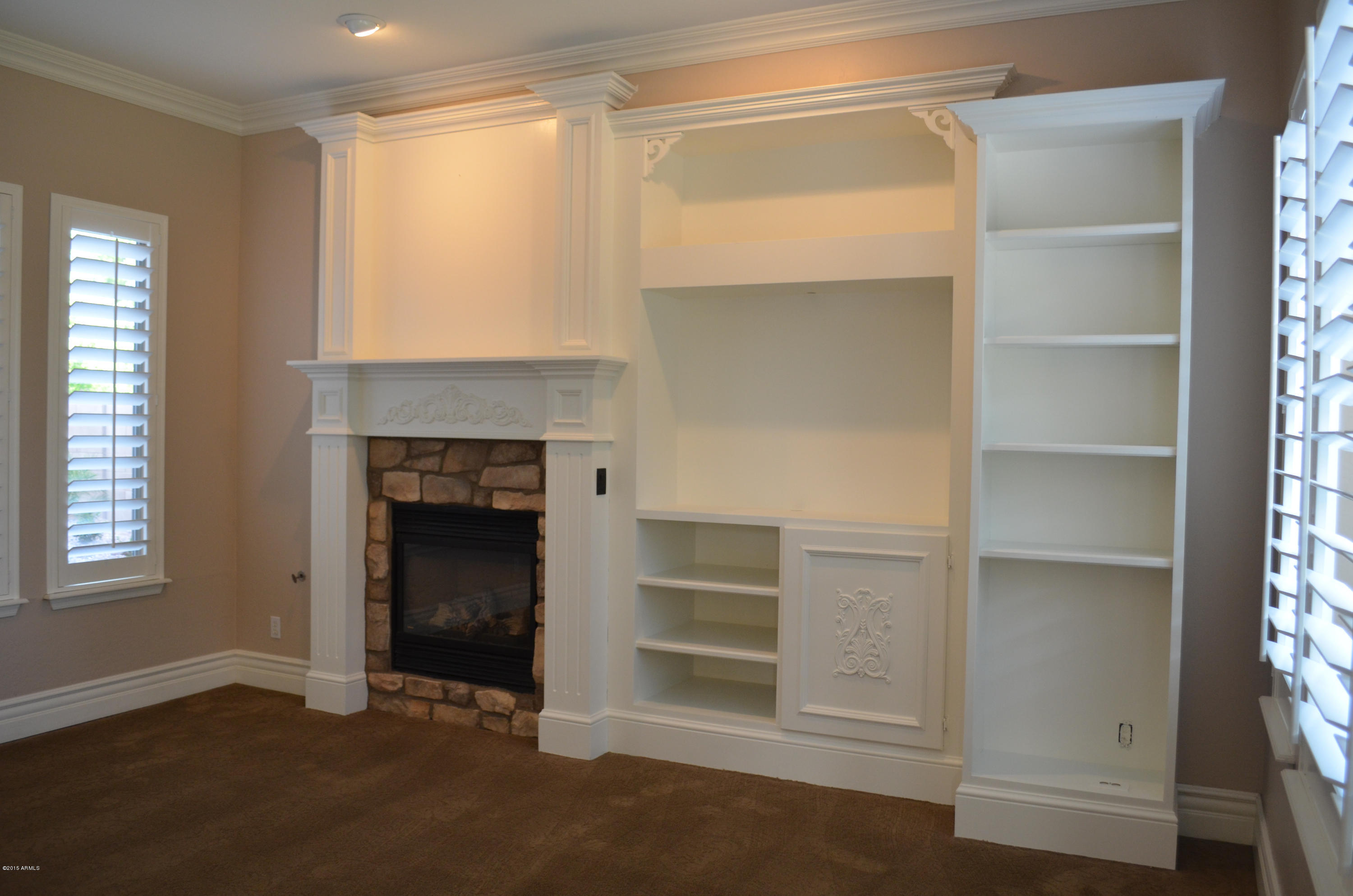 2941 Washington Avenue Gilbert, AZ 85234 - Photo 18 of 57 a room with a fireplace and a window