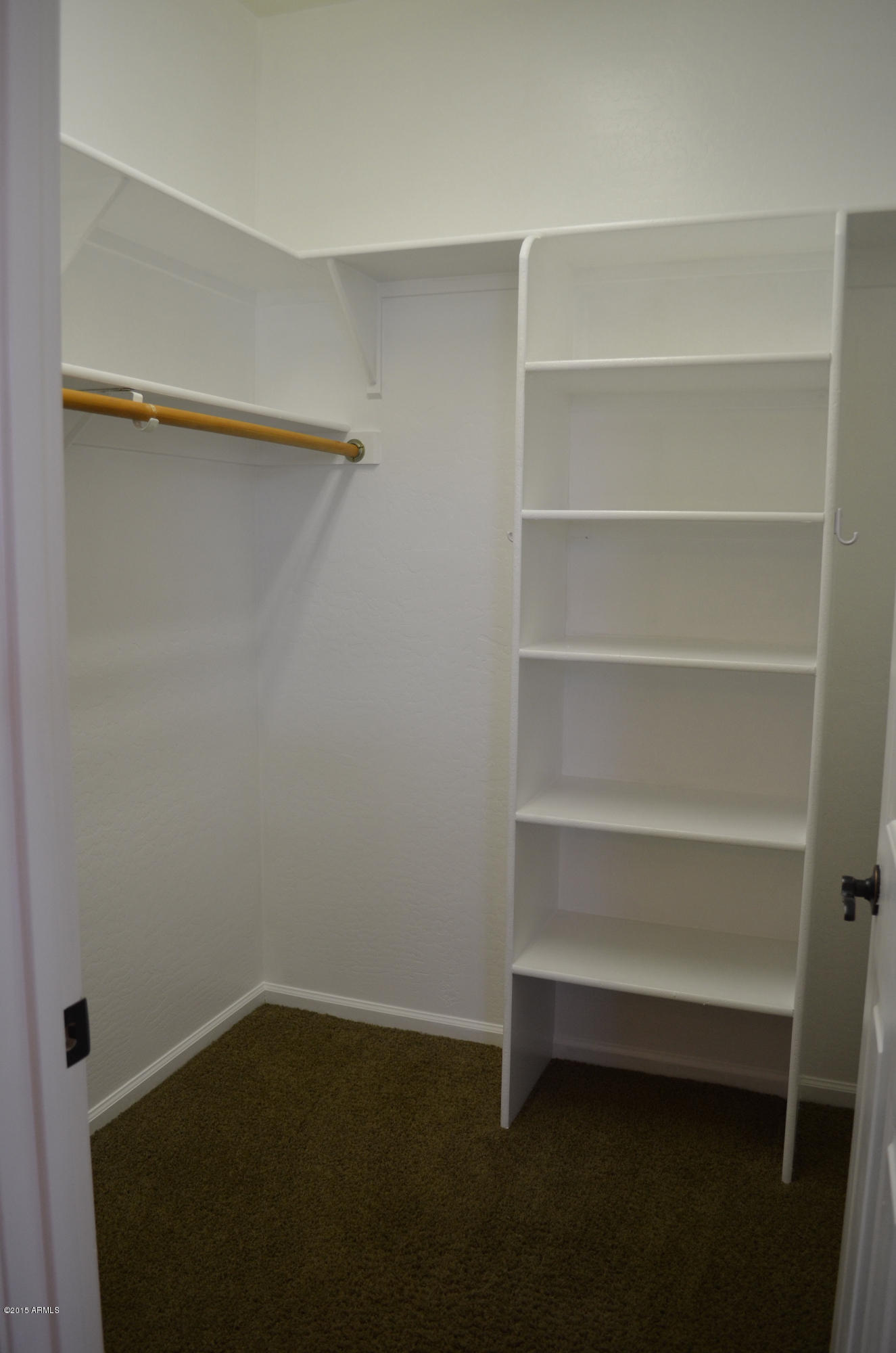 2941 Washington Avenue Gilbert, AZ 85234 - Photo 30 of 57 a view of walk in closet with empty racks