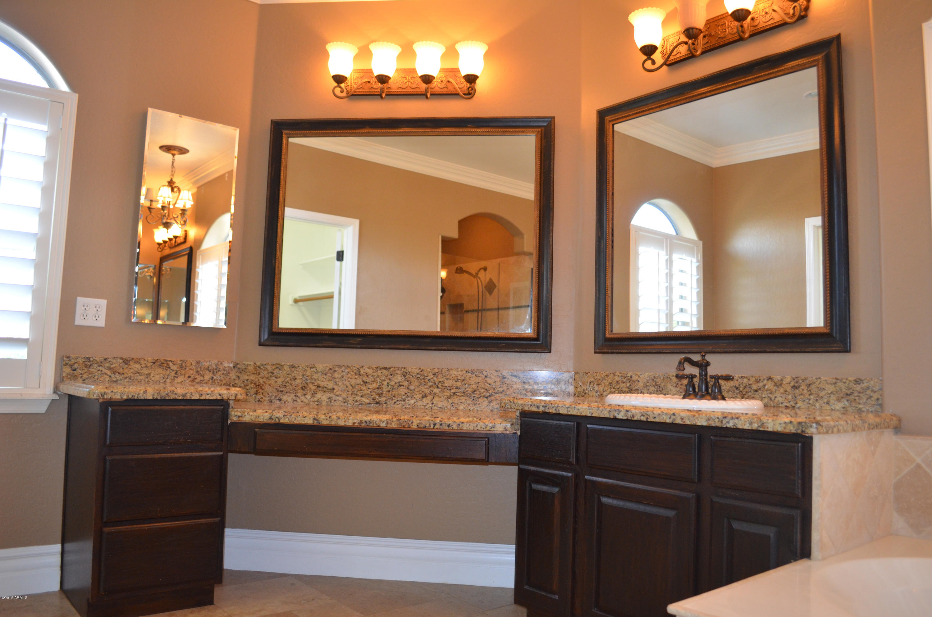 2941 Washington Avenue Gilbert, AZ 85234 - Photo 32 of 57 a bathroom with 2 sink and a mirror