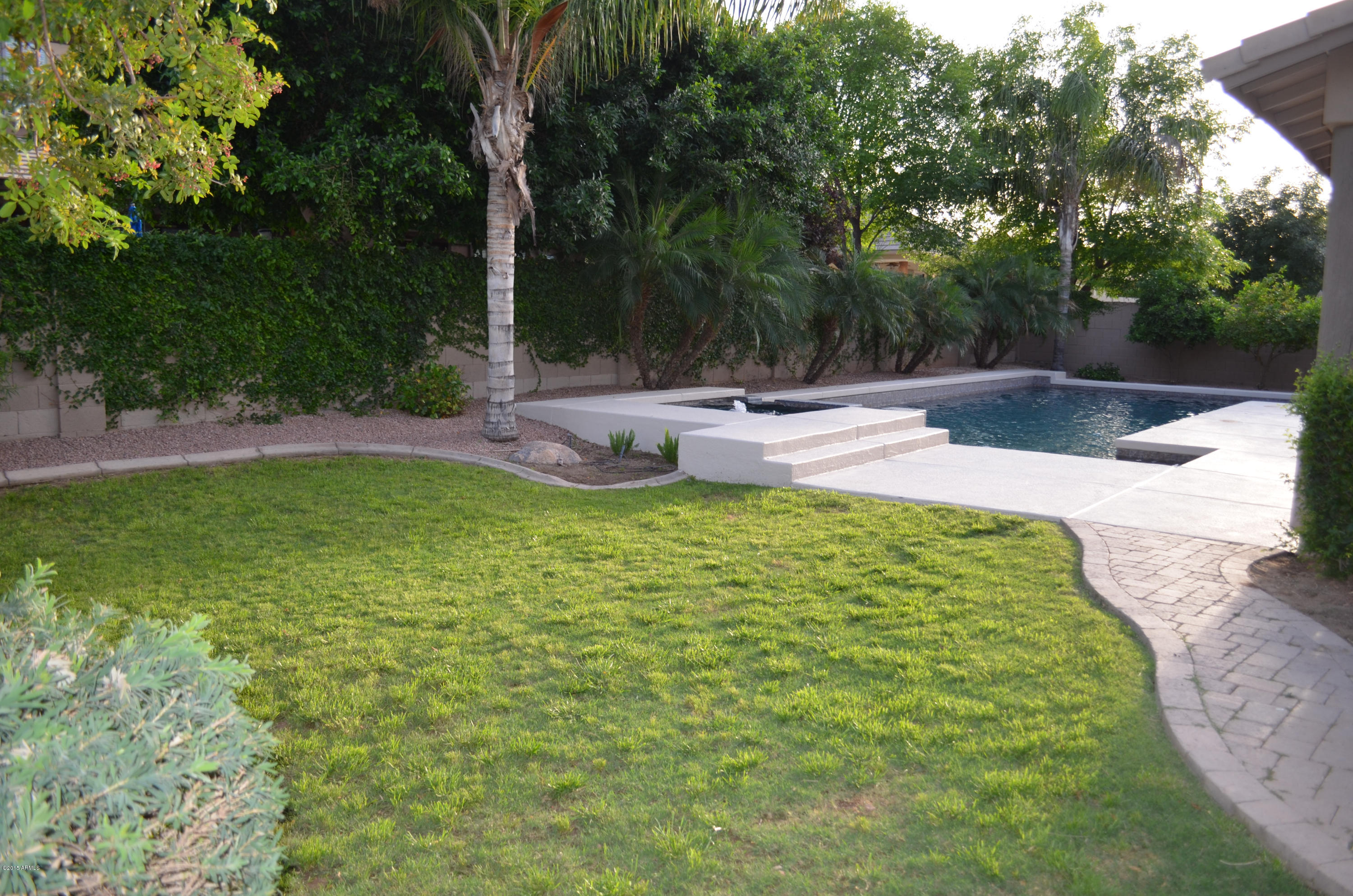 2941 Washington Avenue Gilbert, AZ 85234 - Photo 48 of 57 a view of a swimming pool with a patio