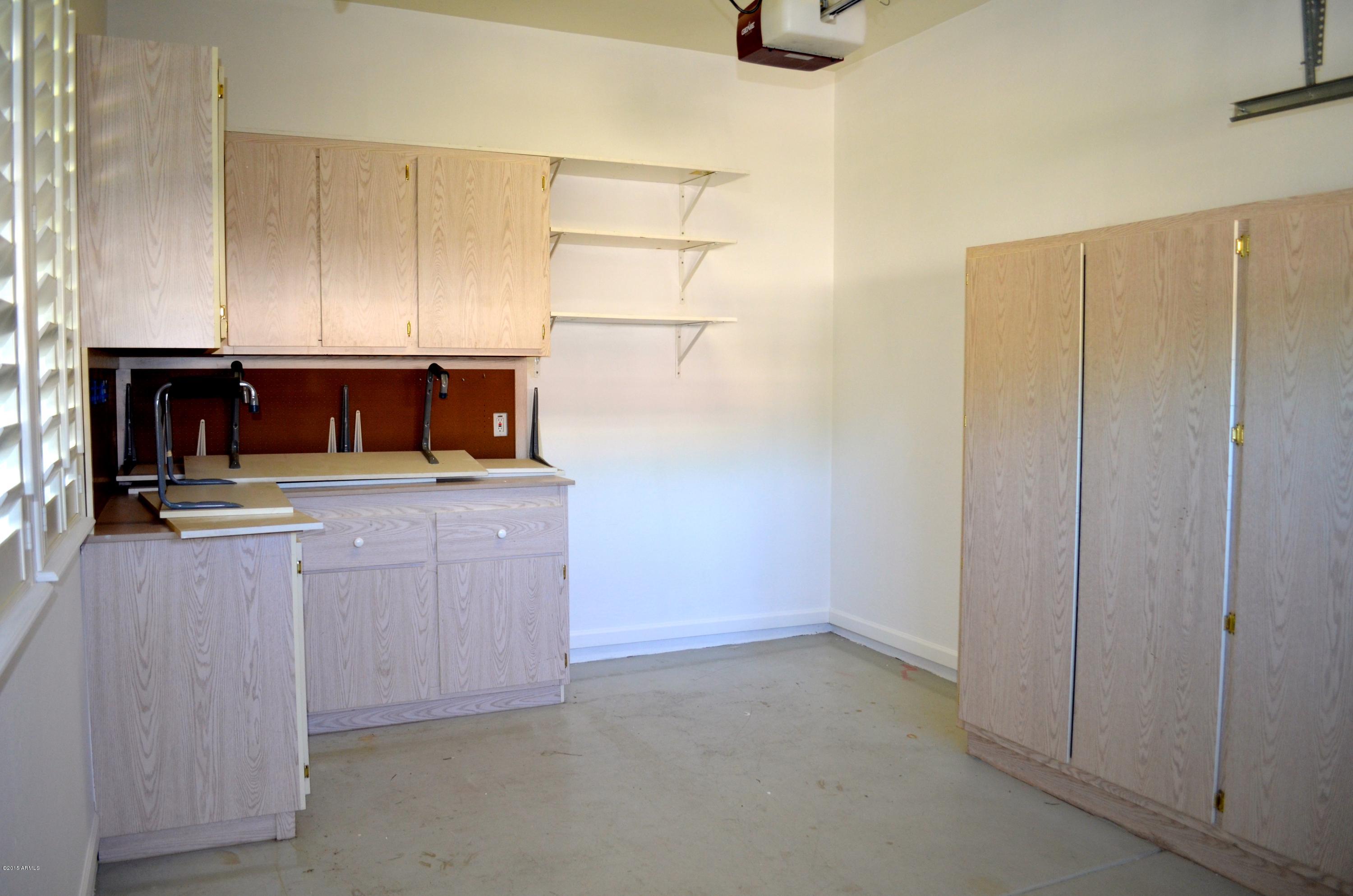 2941 Washington Avenue Gilbert, AZ 85234 - Photo 55 of 57 a kitchen with refrigerator and cabinets
