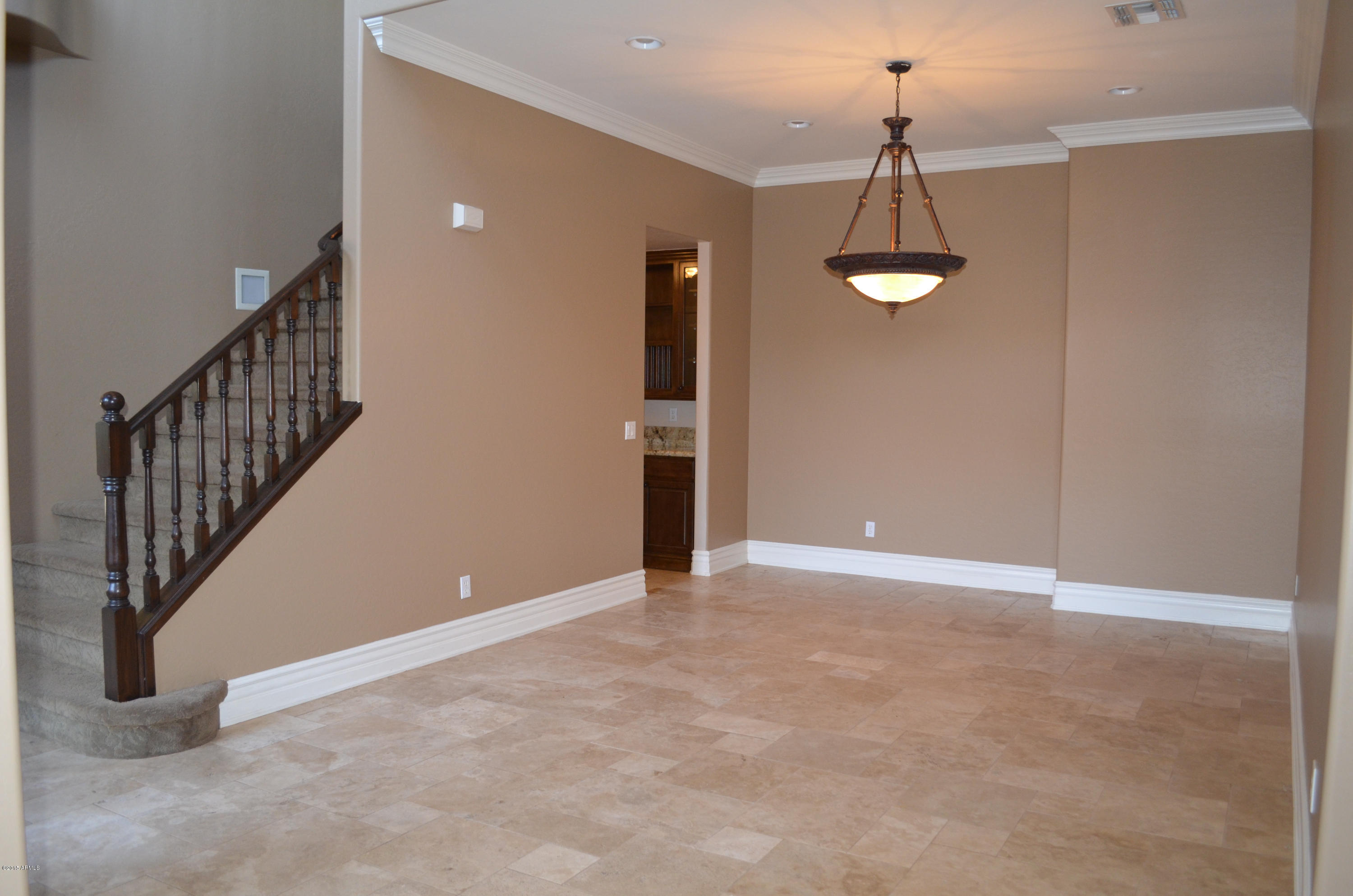 2941 Washington Avenue Gilbert, AZ 85234 - Photo 10 of 57 a view of an empty room with a chandelier