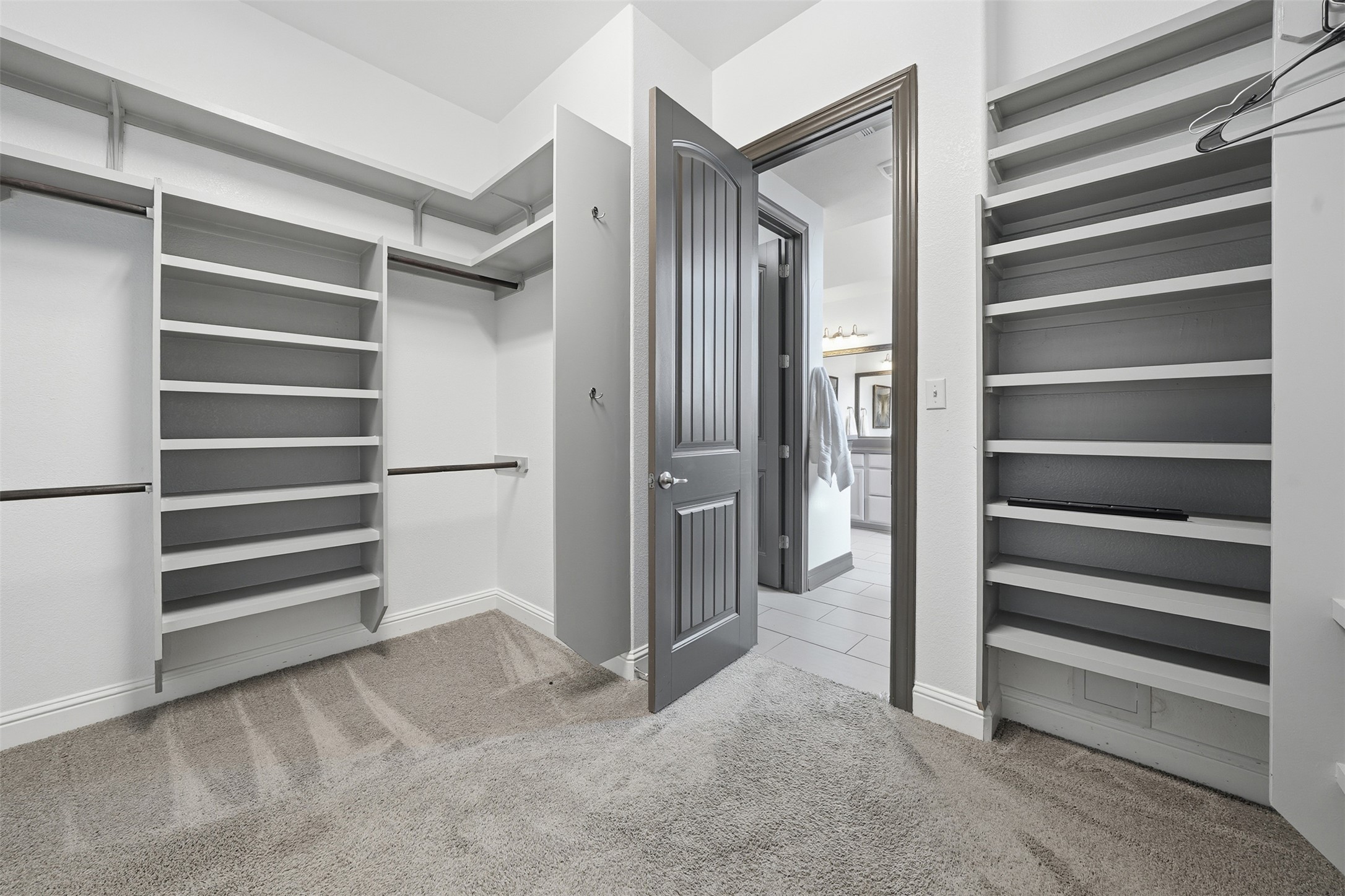 8729 Vantage Point Drive Austin, TX 78737 - Photo 30 of 33 Organized built-in shelving offers abundant storage in this versatile closet space.