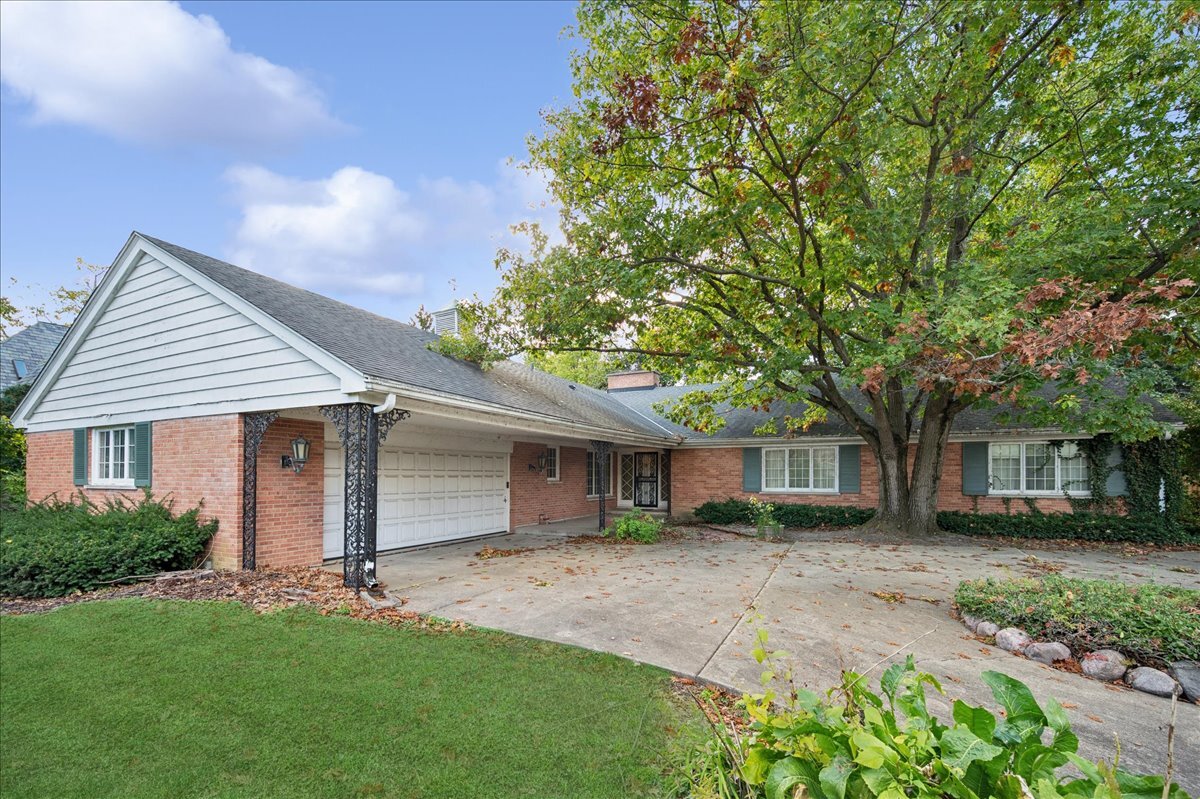 front view of a house with a garden