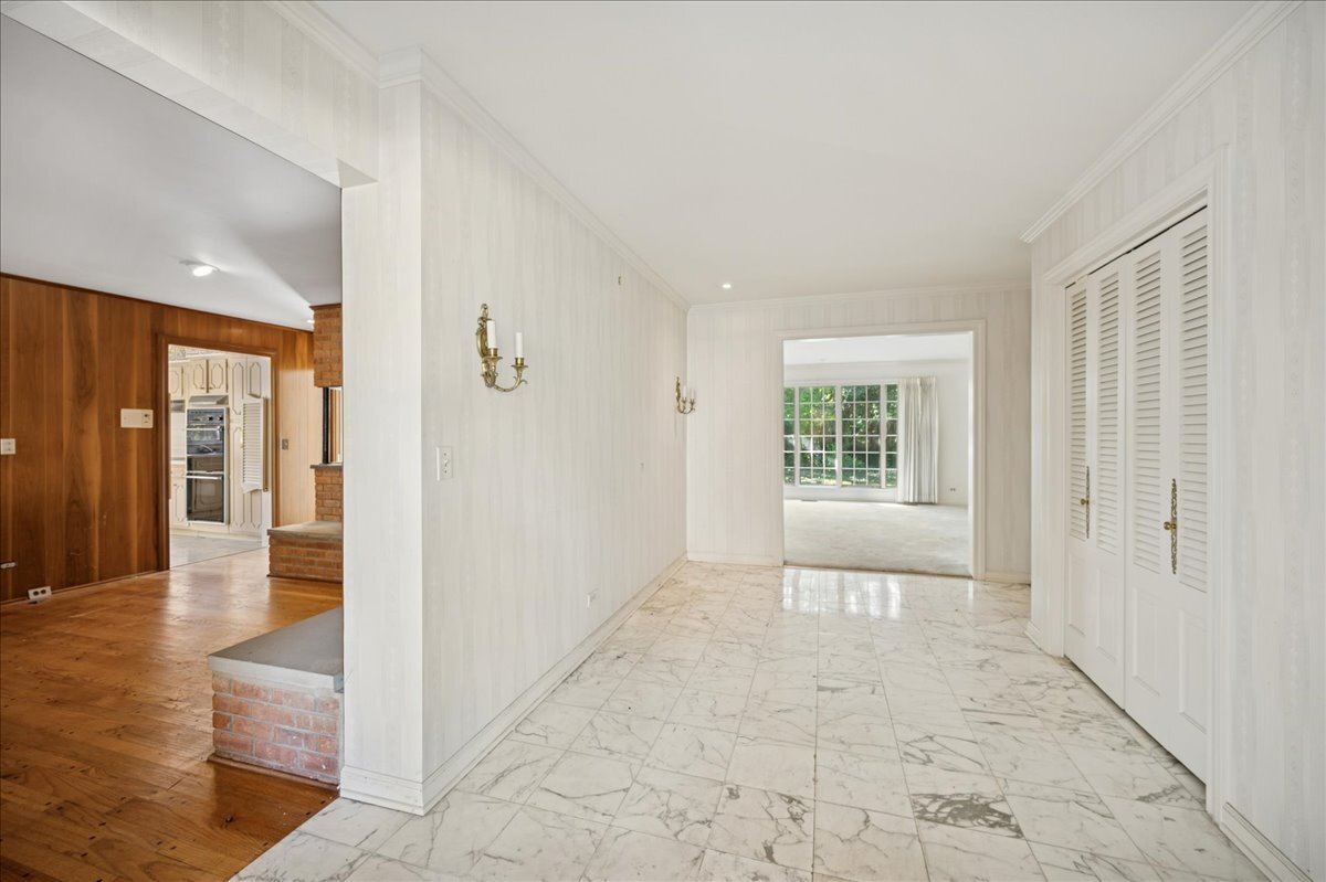 1080 Hillcrest Road Glencoe, IL 60022 - Photo 4 of 33 a view of an entryway with wooden floor and a window