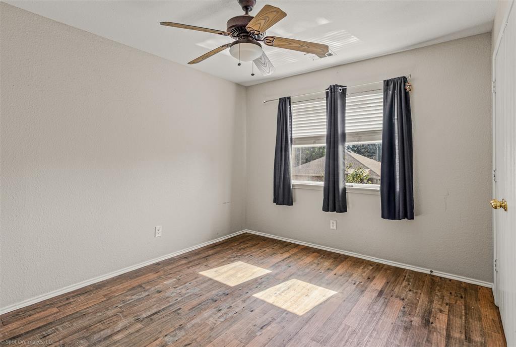 503 Pinto Lane Forney, TX 75126 - Photo 12 of 20 a view of wooden floor and chandelier fan in a room