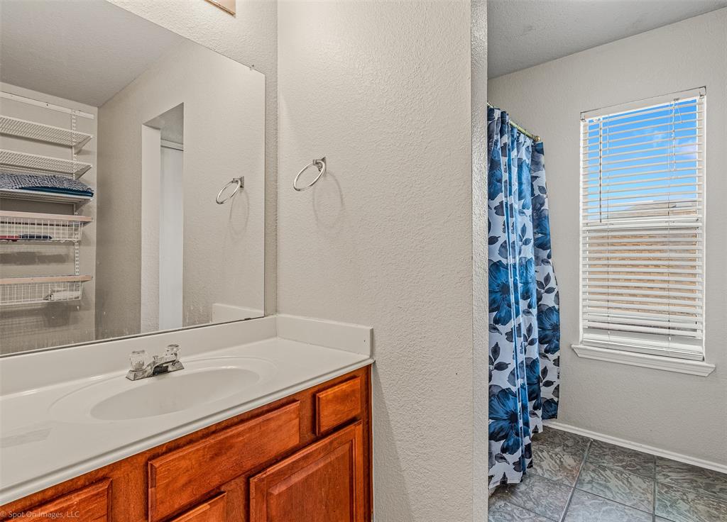 503 Pinto Lane Forney, TX 75126 - Photo 14 of 20 a bathroom with a sink and a mirror