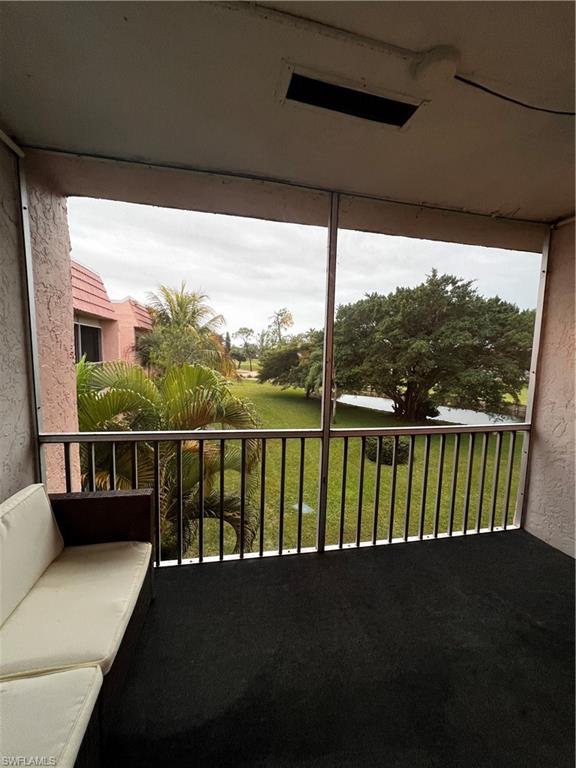 100 Forest Lakes Boulevard, Unit 307 Naples, FL 34105 - Photo 13 of 16 Balcony with a water view