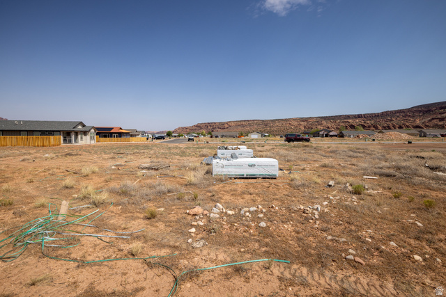212 Lidia Circle, Unit 17 Moab, UT 84532 - Photo 15 of 24 Expansive undeveloped land parcel featuring a rugged natural landscape and distant red rock formations