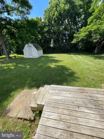 a view of a swimming pool with a backyard