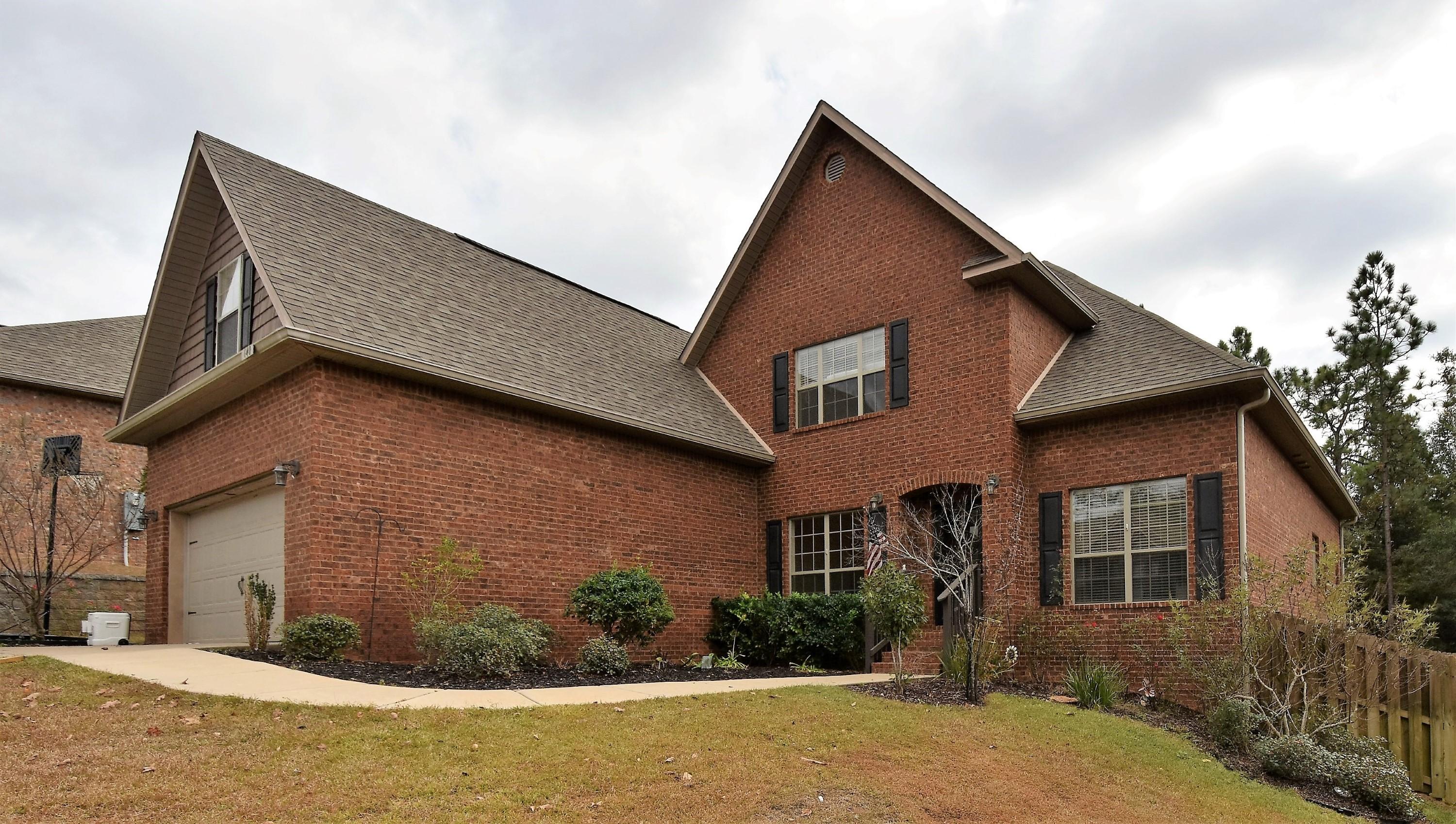 640 Red Fern Road Crestview, FL 32536 - Photo 1 of 50 a front view of a house with garden