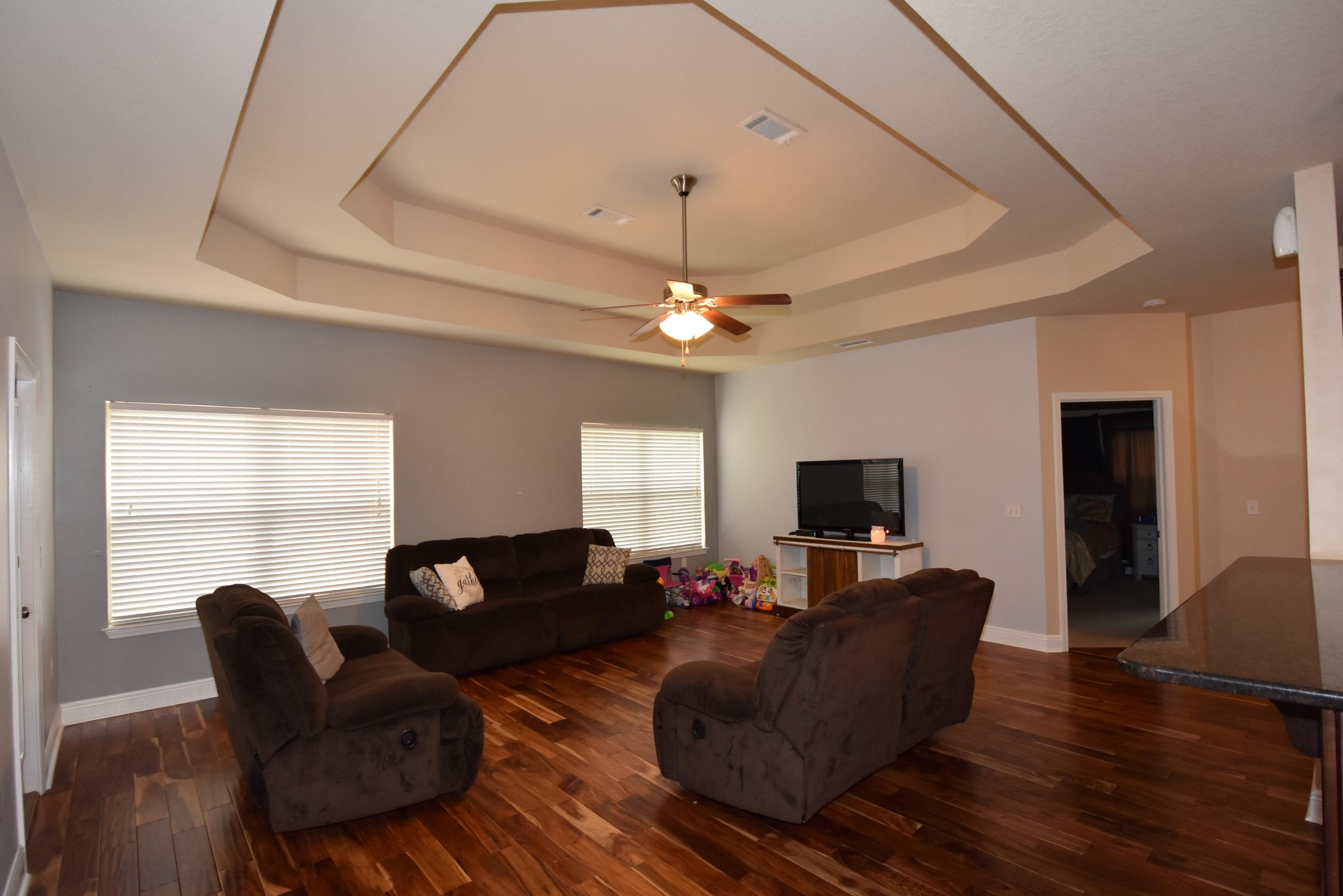 640 Red Fern Road Crestview, FL 32536 - Photo 11 of 50 a living room with furniture a window and a flat screen tv