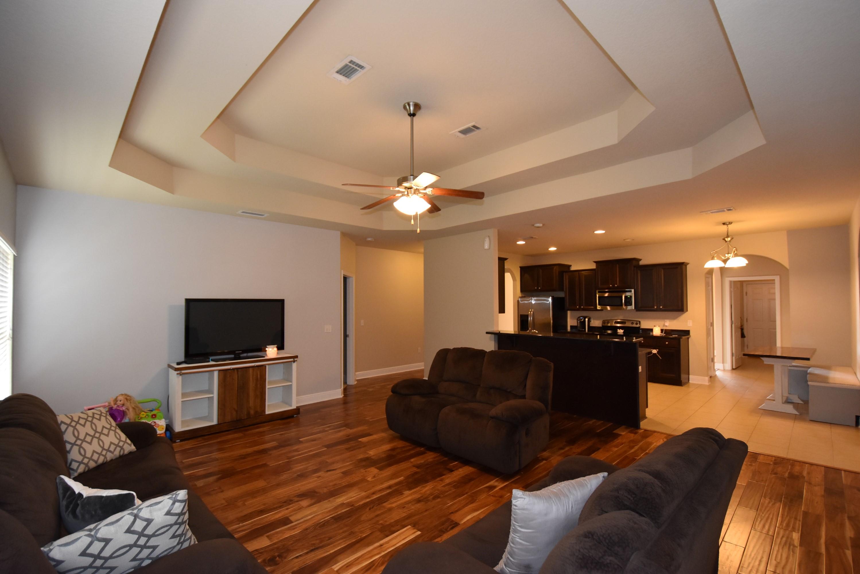 640 Red Fern Road Crestview, FL 32536 - Photo 12 of 50 a living room with furniture and a flat screen tv