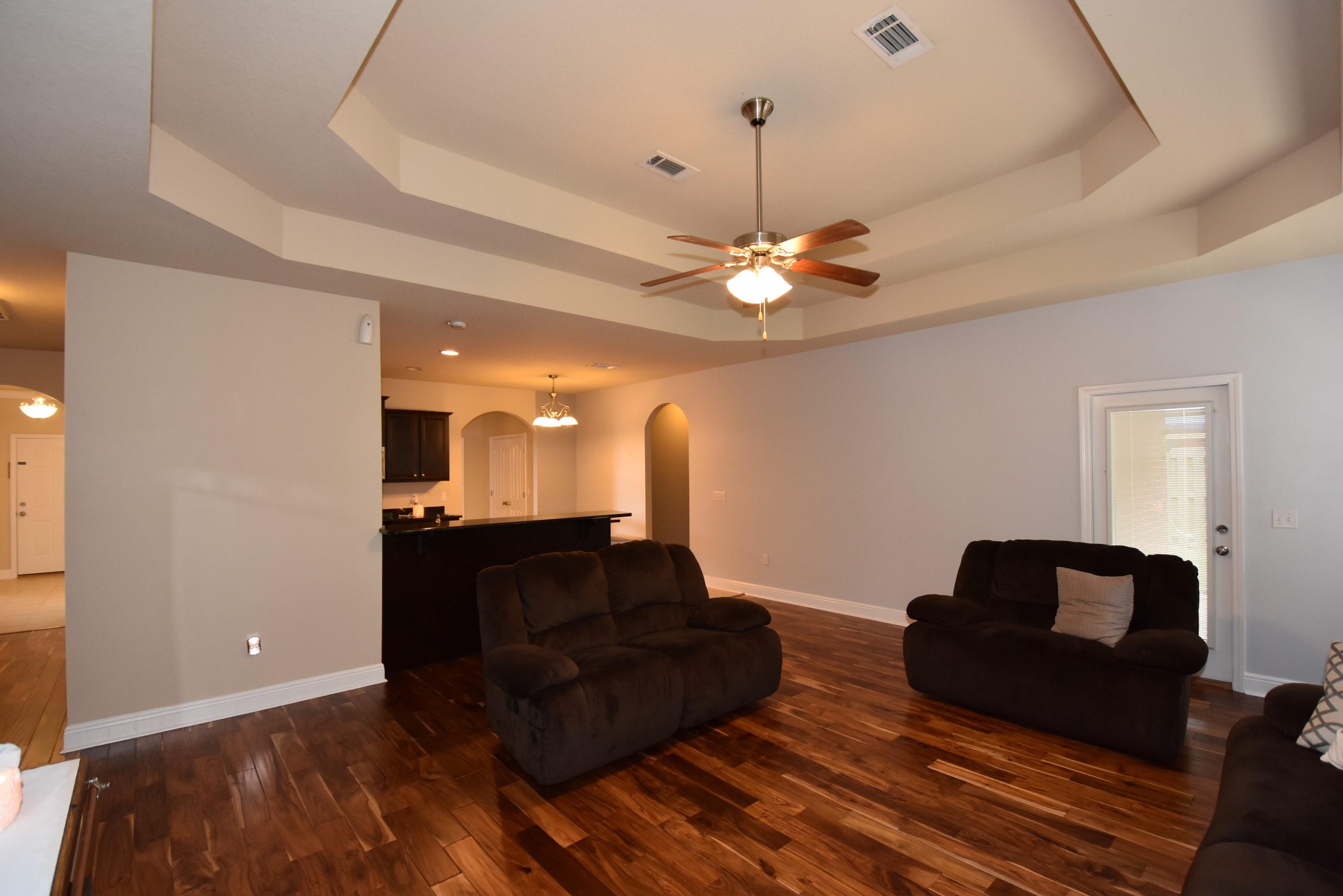 640 Red Fern Road Crestview, FL 32536 - Photo 13 of 50 a living room with furniture and a chandelier