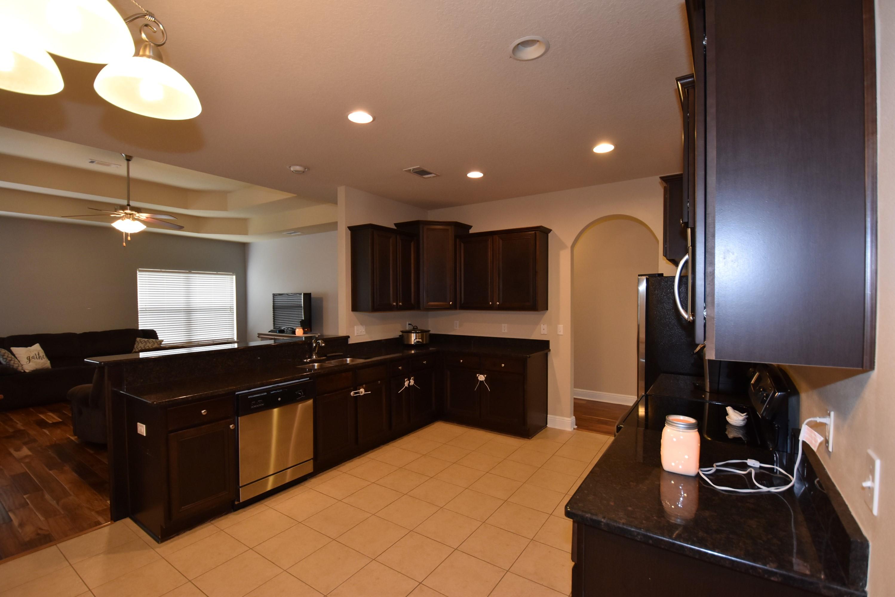 640 Red Fern Road Crestview, FL 32536 - Photo 15 of 50 a kitchen with a sink and cabinets