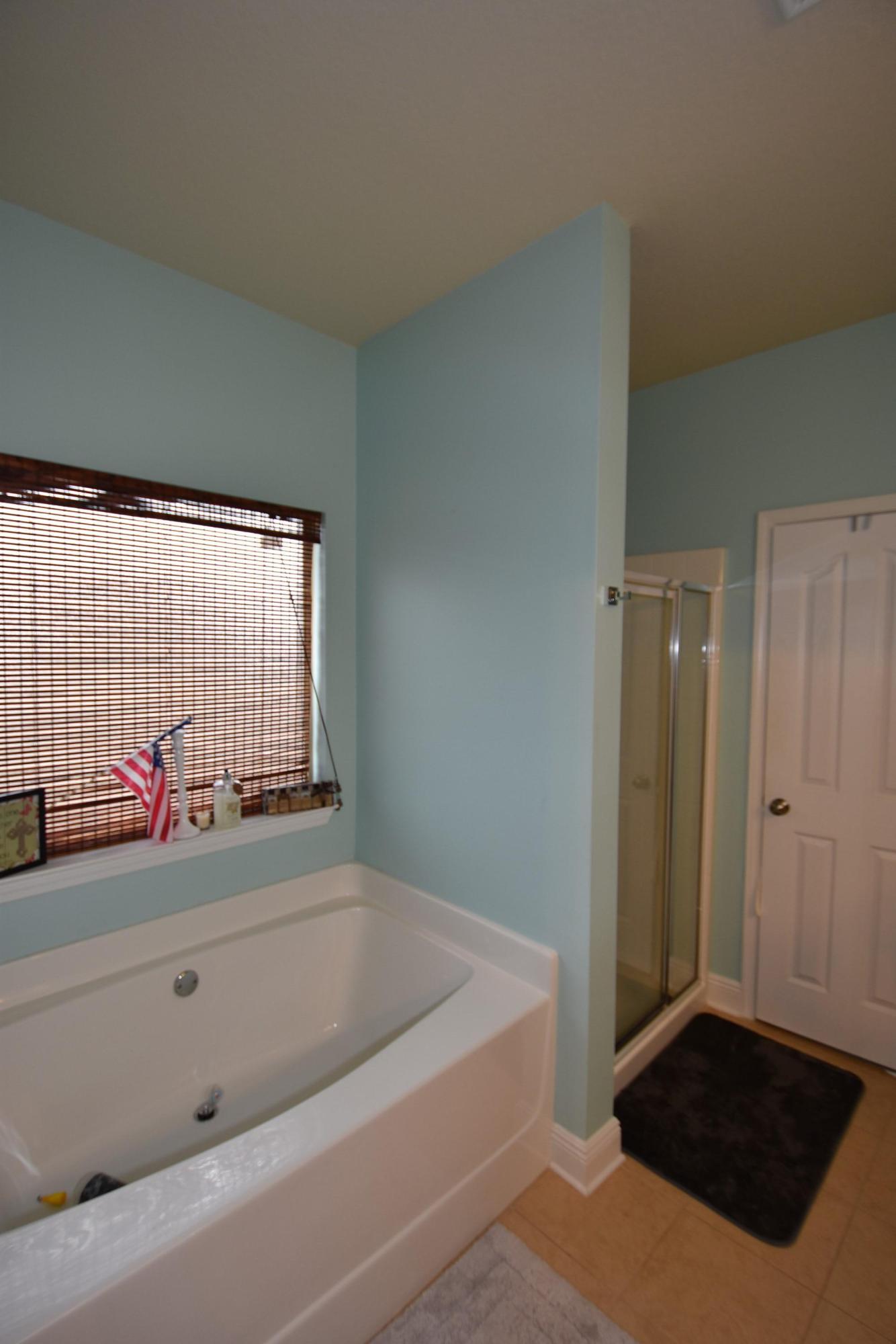 640 Red Fern Road Crestview, FL 32536 - Photo 23 of 50 a bathroom with a tub shower and a sink