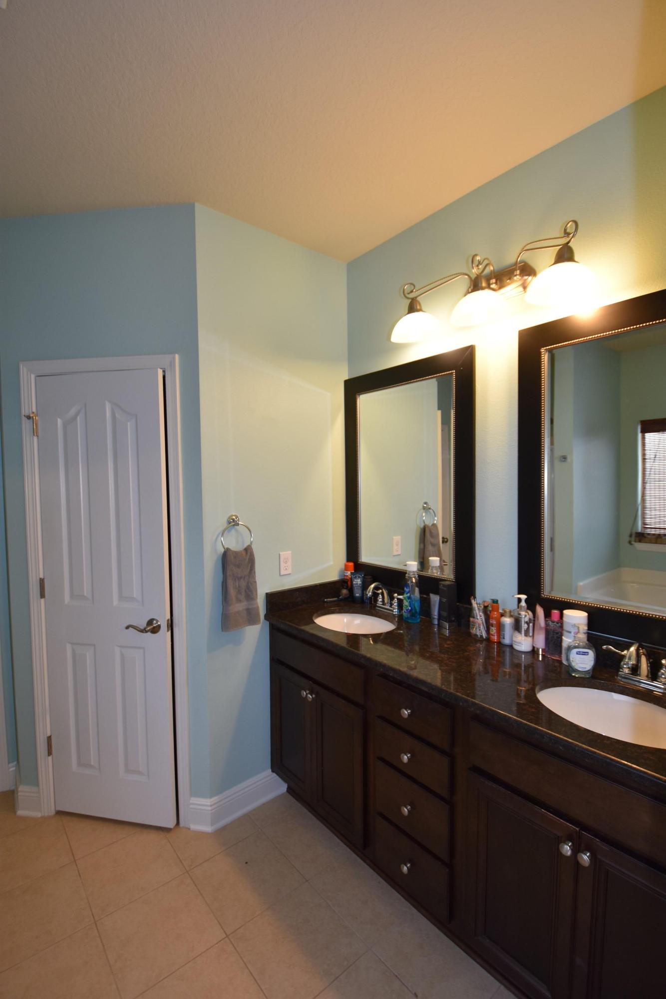 640 Red Fern Road Crestview, FL 32536 - Photo 24 of 50 a bathroom with double vanity and a mirror