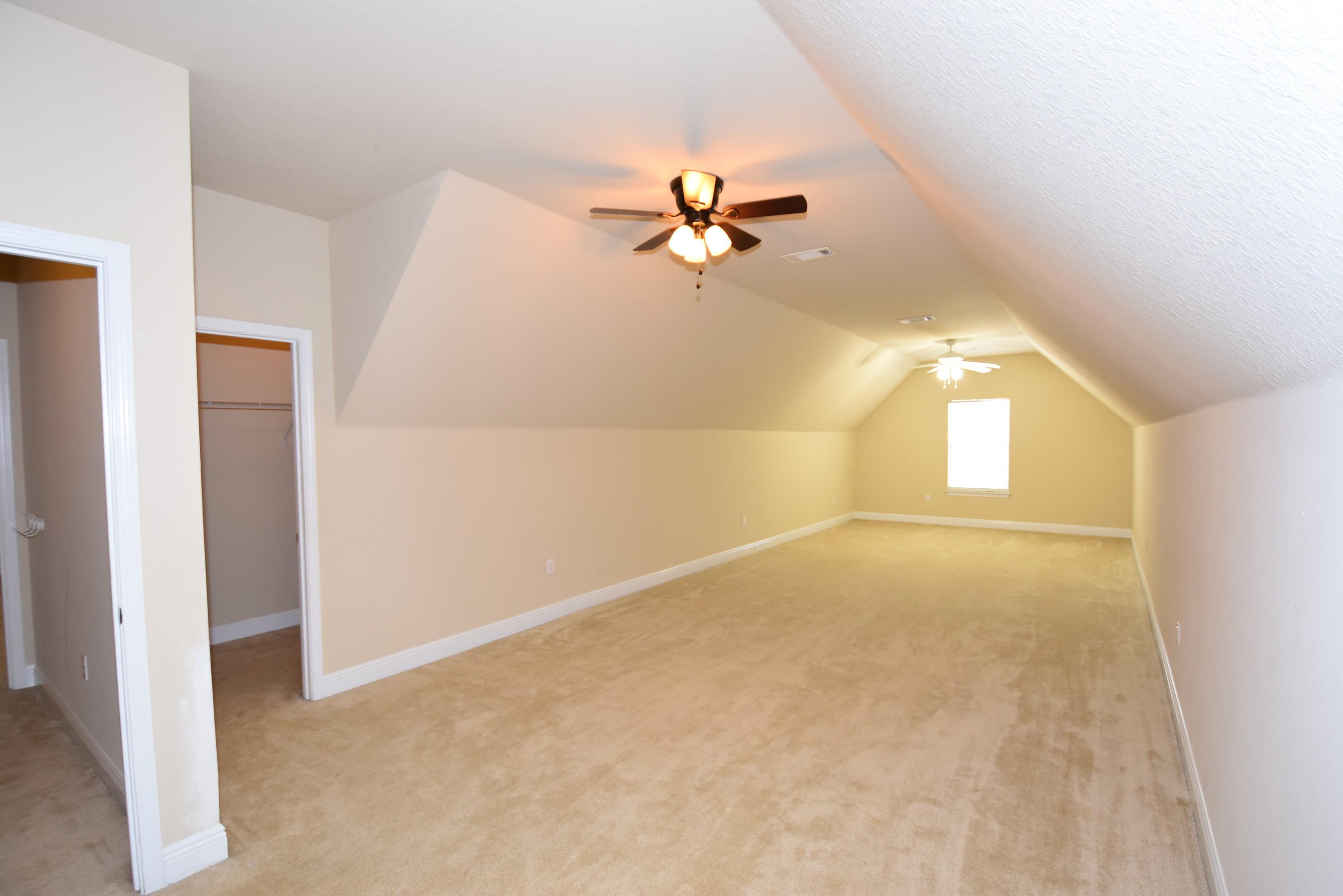 640 Red Fern Road Crestview, FL 32536 - Photo 31 of 50 an empty room with windows and fan