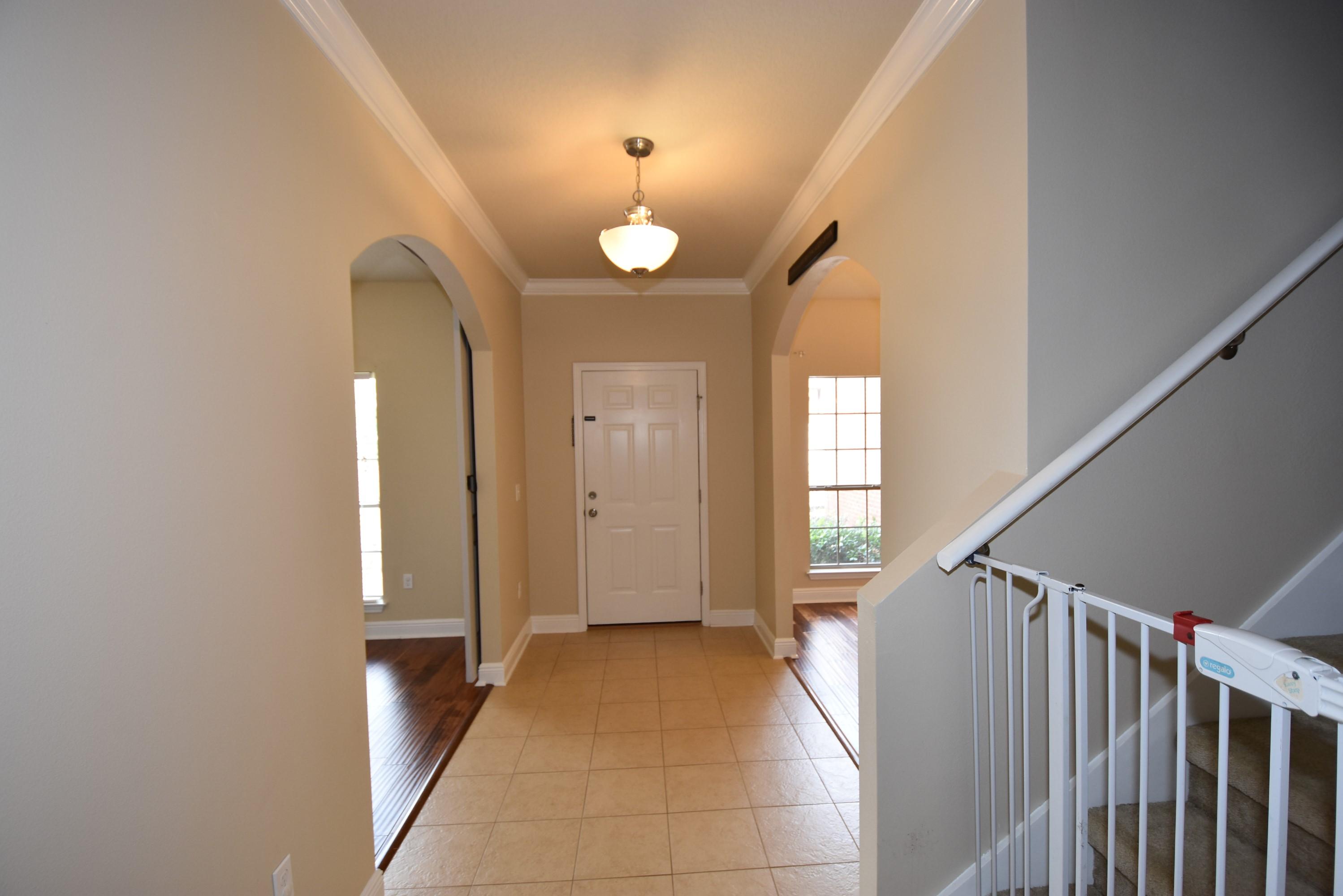 640 Red Fern Road Crestview, FL 32536 - Photo 43 of 50 a view of a hallway with windows and stairs