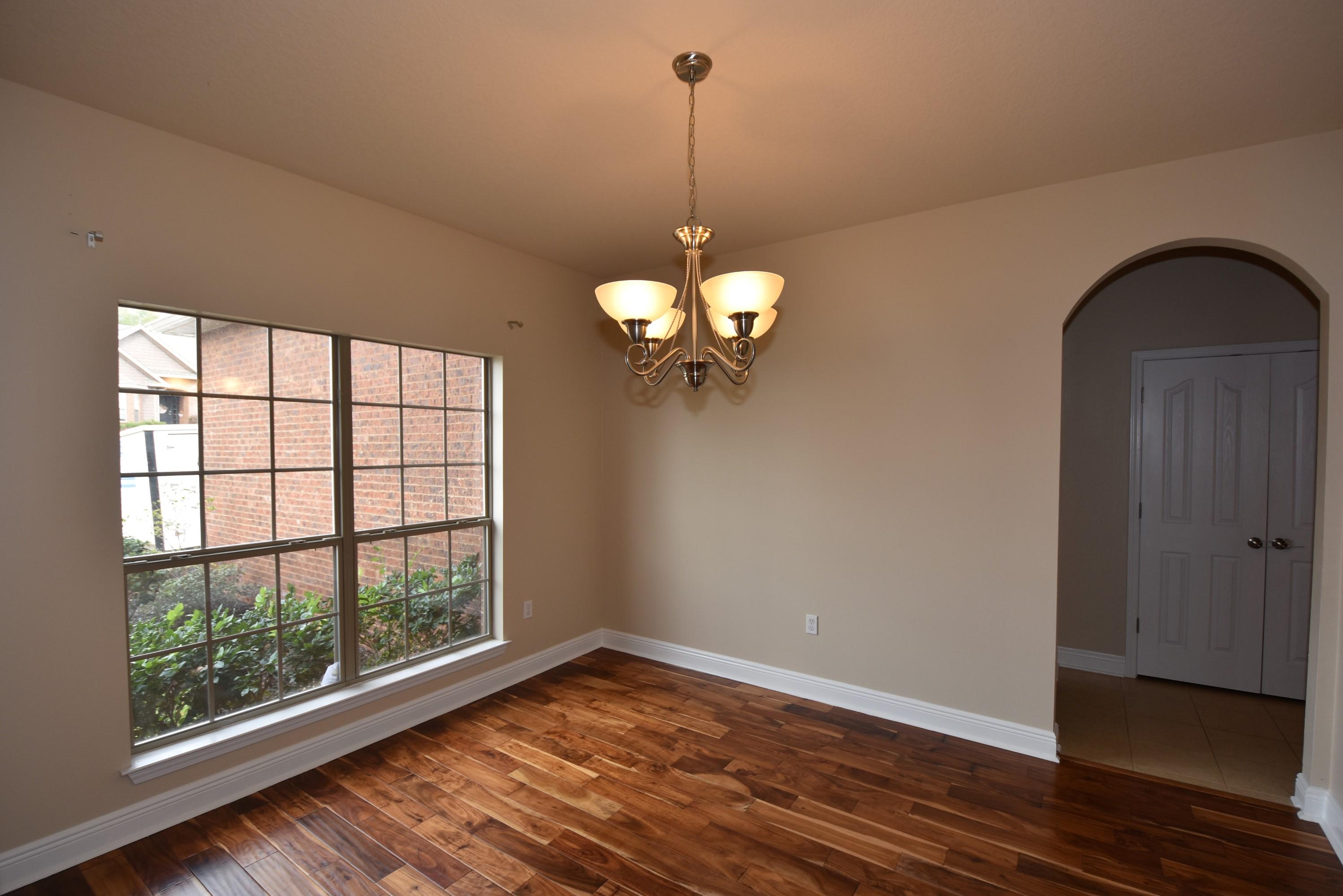 640 Red Fern Road Crestview, FL 32536 - Photo 8 of 50 a view of a room with wooden floor and large window