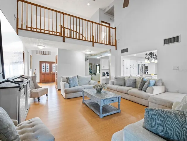 a spacious bedroom with a bed and a couch